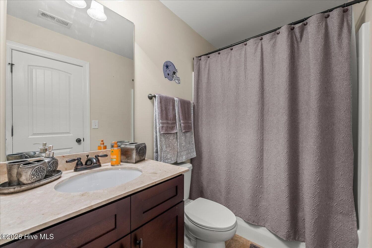 Bathroom connected to Bedroom 6 on level three. - 8663 Crenshaw Drive, Grovetown, GA 30813