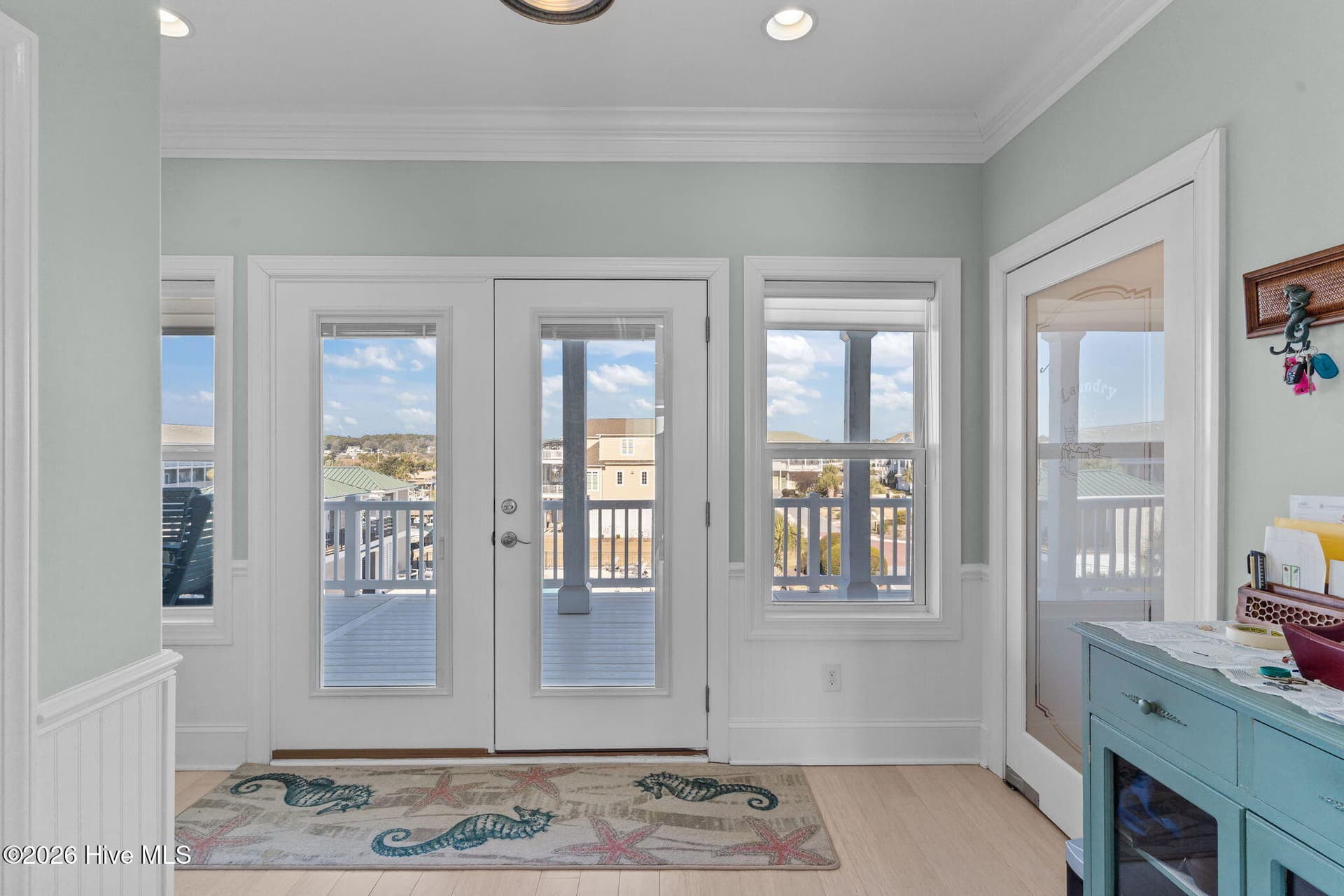 Top floor, walkway to back deck. Laundry room to right, utility room with generator hookup to the left. - 3 Gatha Lane, Ocean Isle Beach, NC 28469