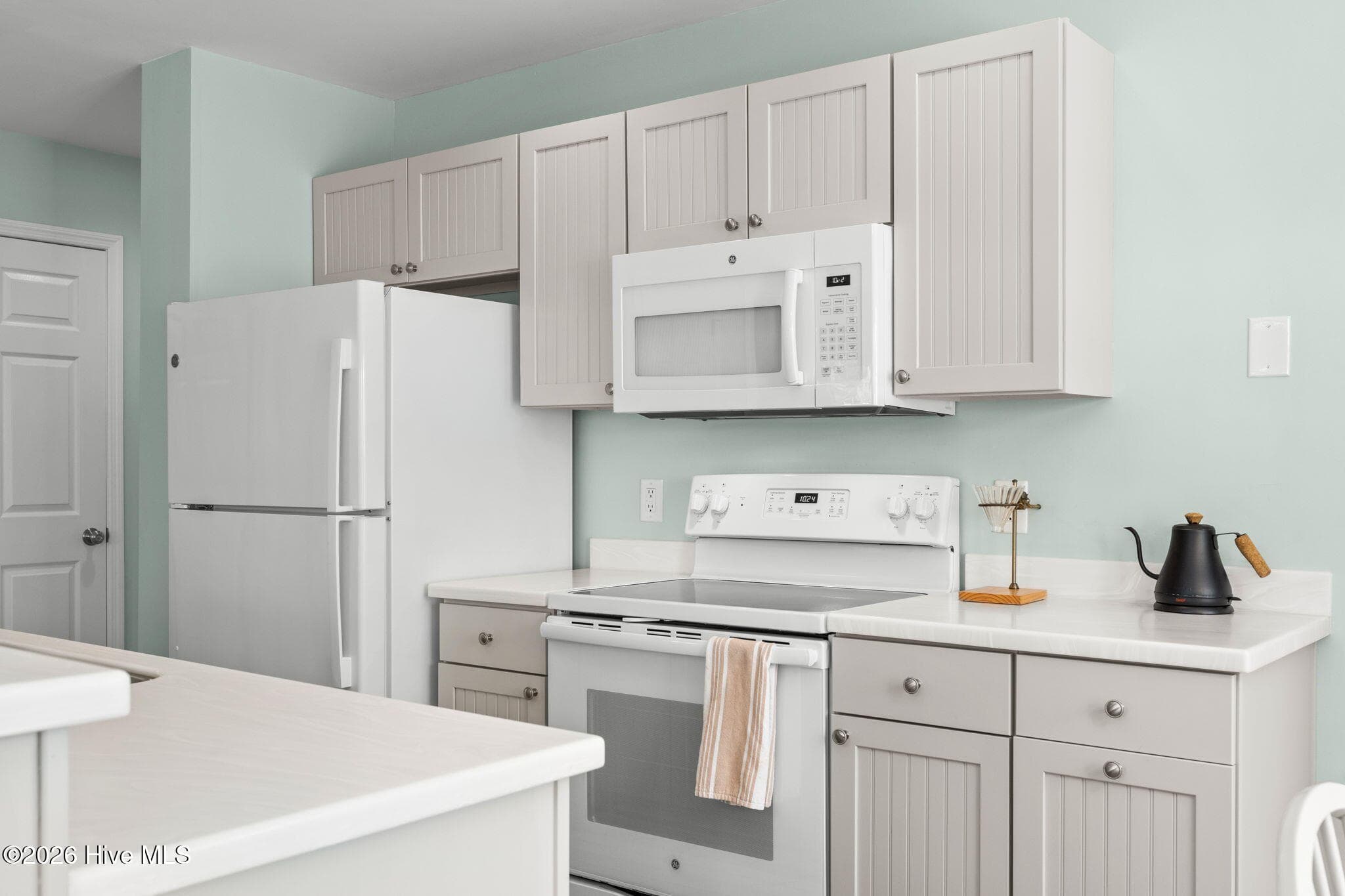 White/offwhite kitchen gives a great clean presentation - 3350 Club Villas Drive # 801, Southport, NC 28461, Southport