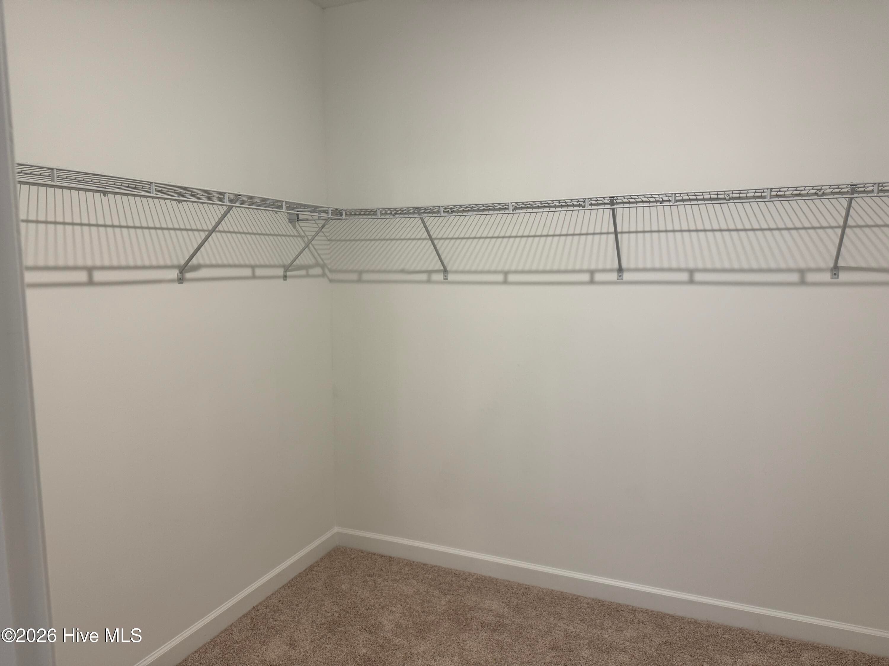 Primary suite features a Private Bathroom with Tile Shower and Large Walk-in Closet - 4145 Workman Loop 66, Leland, NC 28451