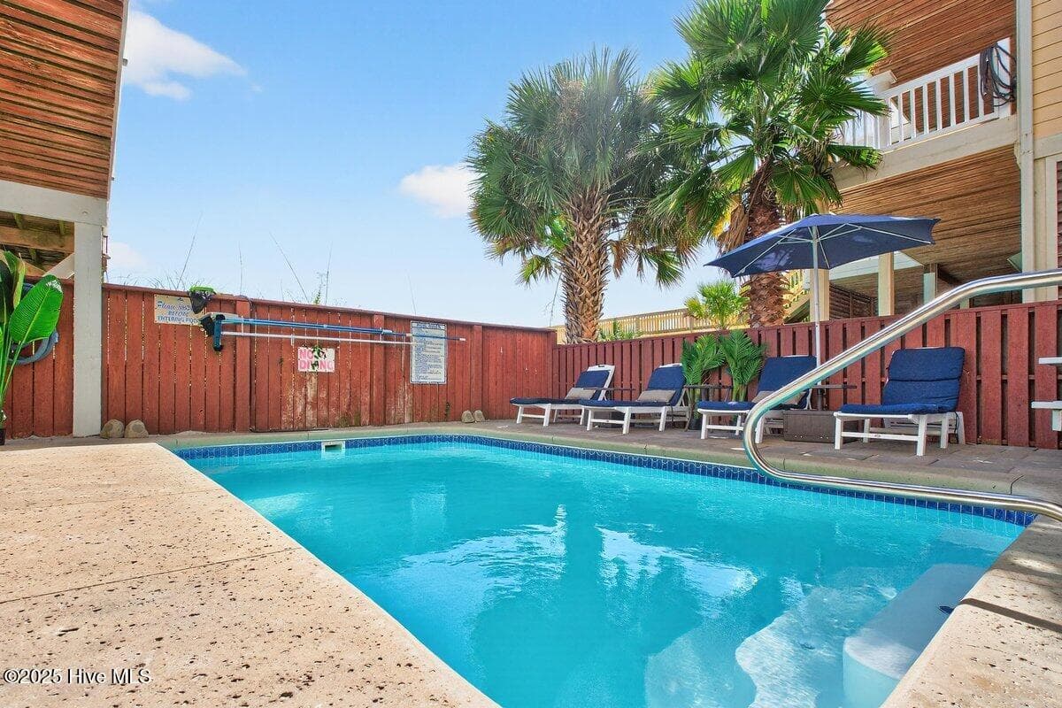 A 10' long pool with heater, if needed, is the center piece of the fenced ocean side yard. - 7 Coggeshall Drive W, Ocean Isle Beach, NC 28469, Ocean Isle Beach