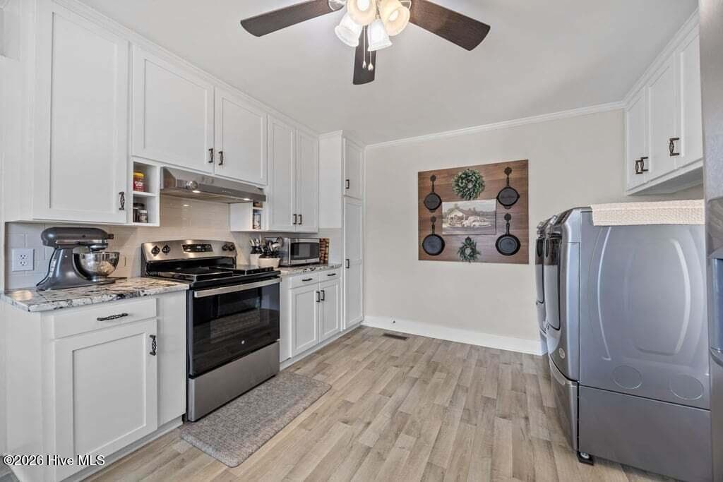 KITCHEN WITH WASHER AND DRYER LOCATION - 1307 N Respess Street, Washington, NC 27889