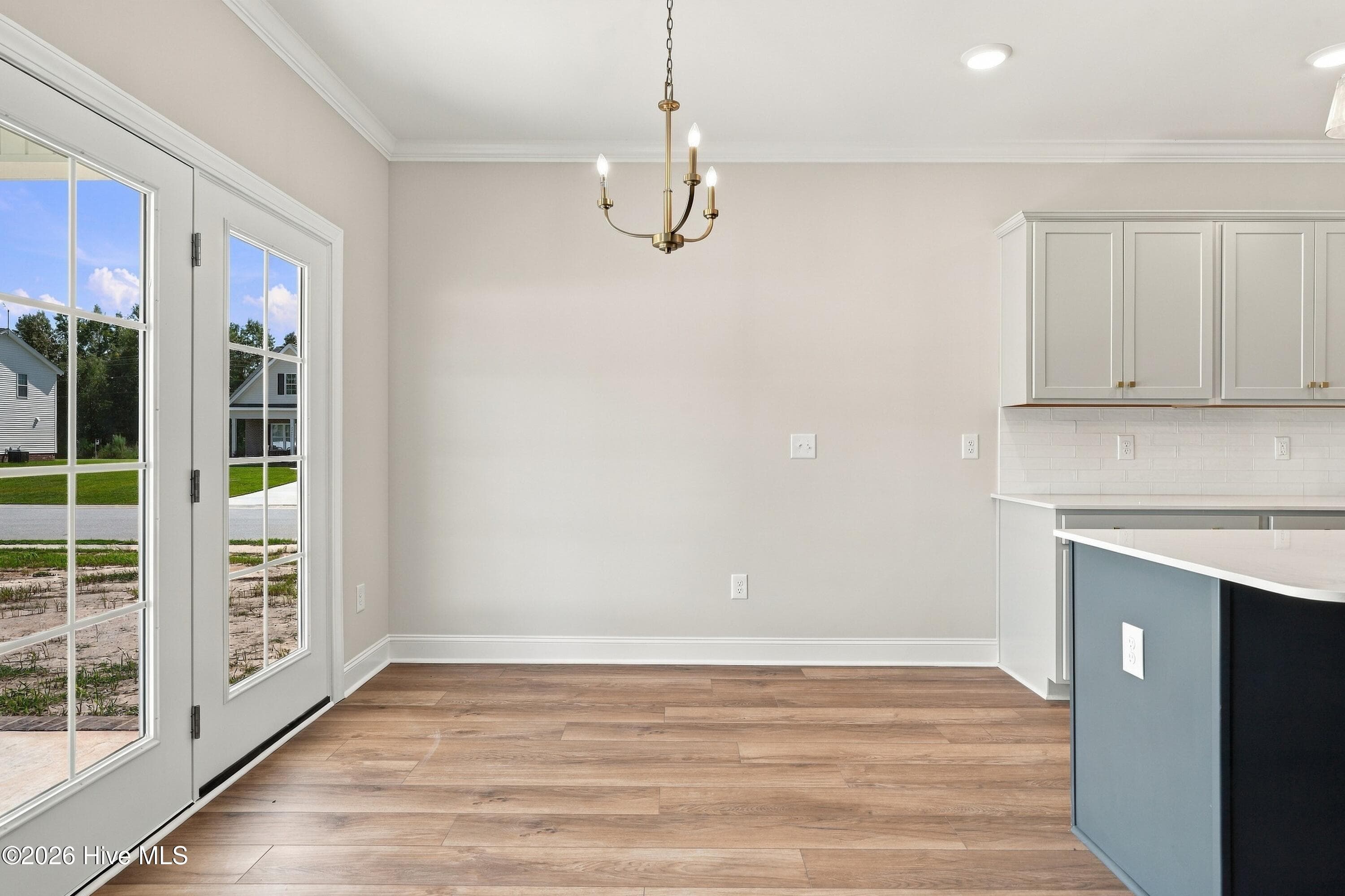 dining space that has great natural lighting and allows you to step out to the covered patio - 3229 Meadow Drive, Farmville, NC 27828