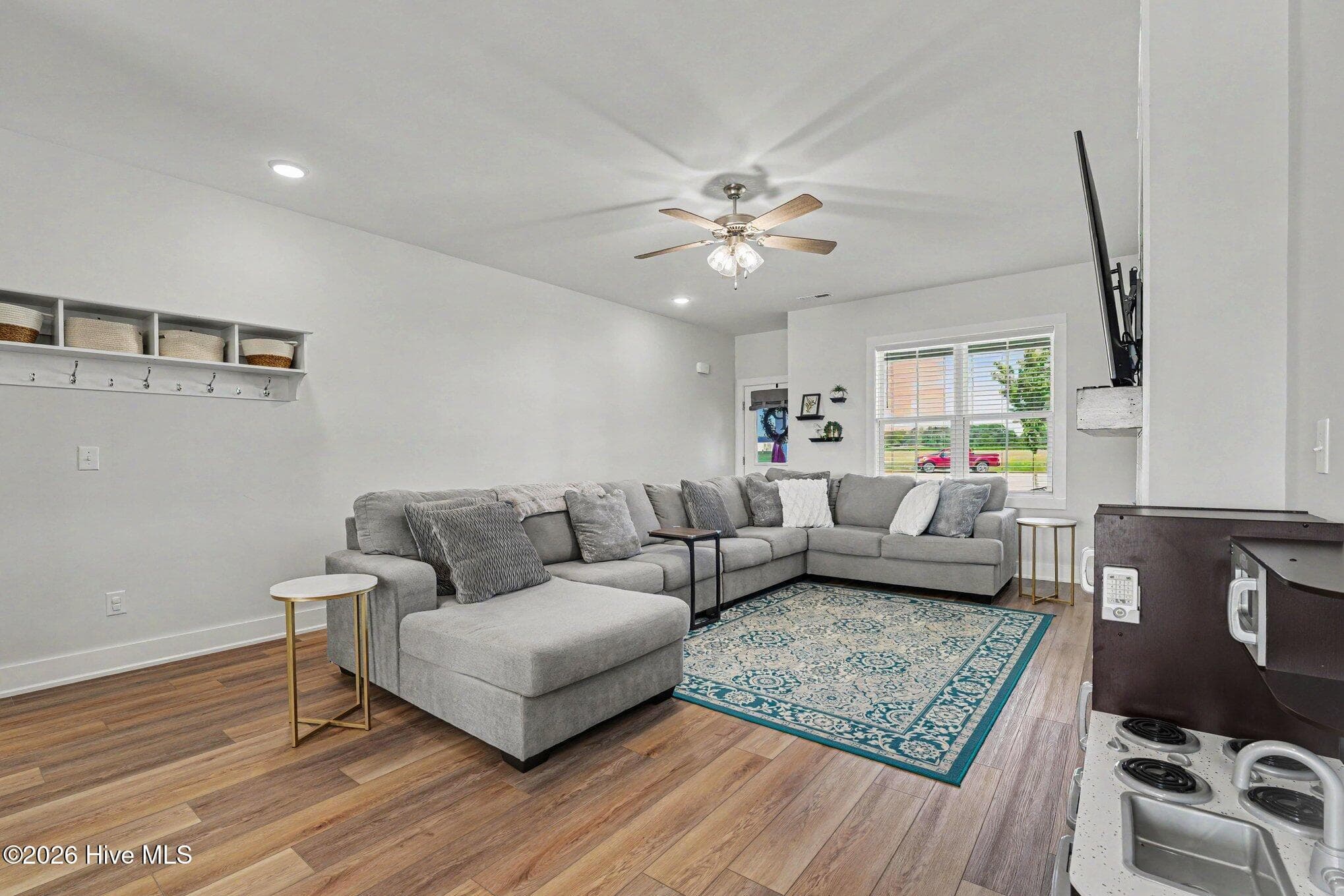 Living room with ceiling fan and recessed lighting - 176 Glenwood Place, Kenly, NC 27542