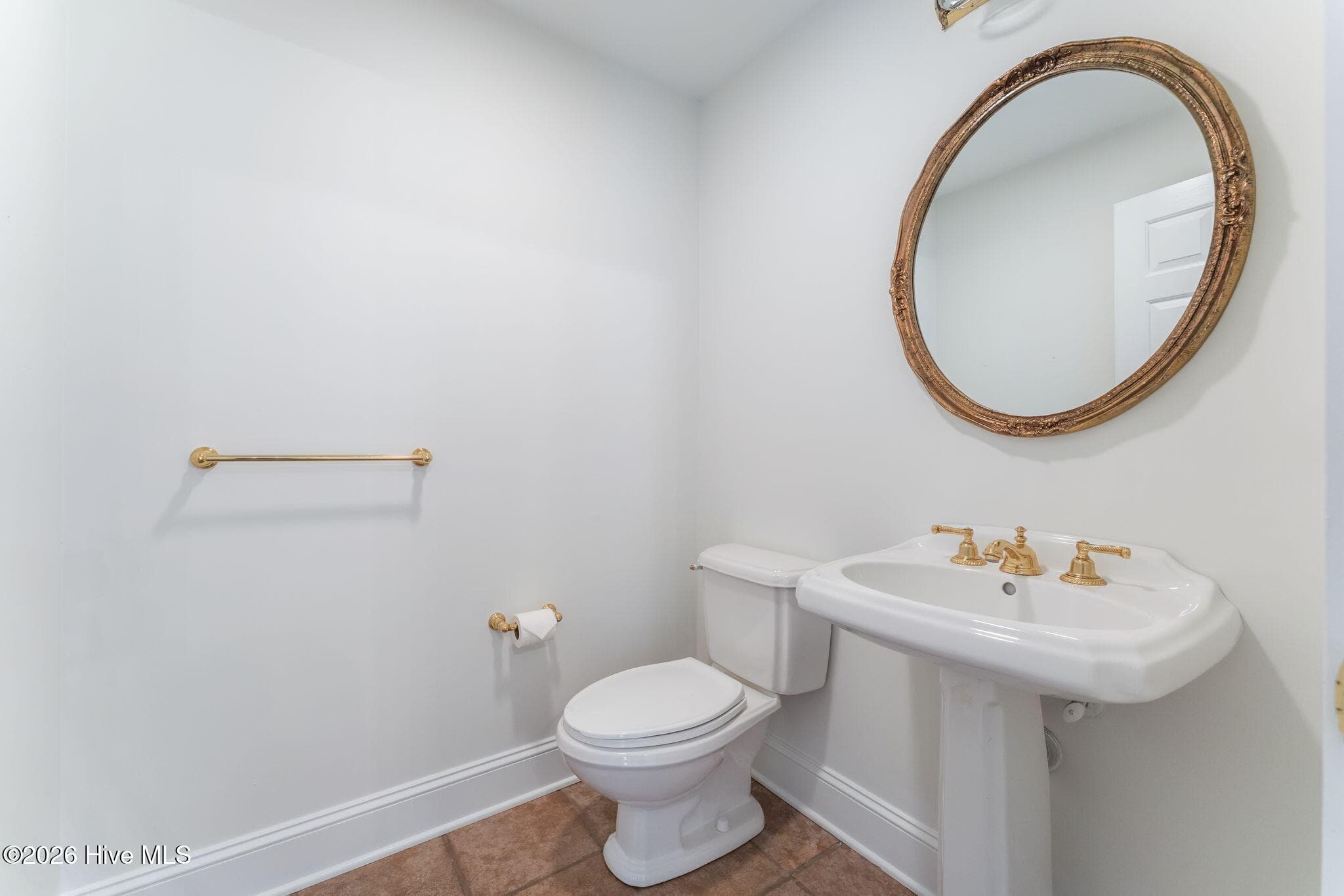 Powder room conveniently located in the foyer amongst the multiple living areas. - 22 Lochmere Drive, Pinehurst, NC 28374