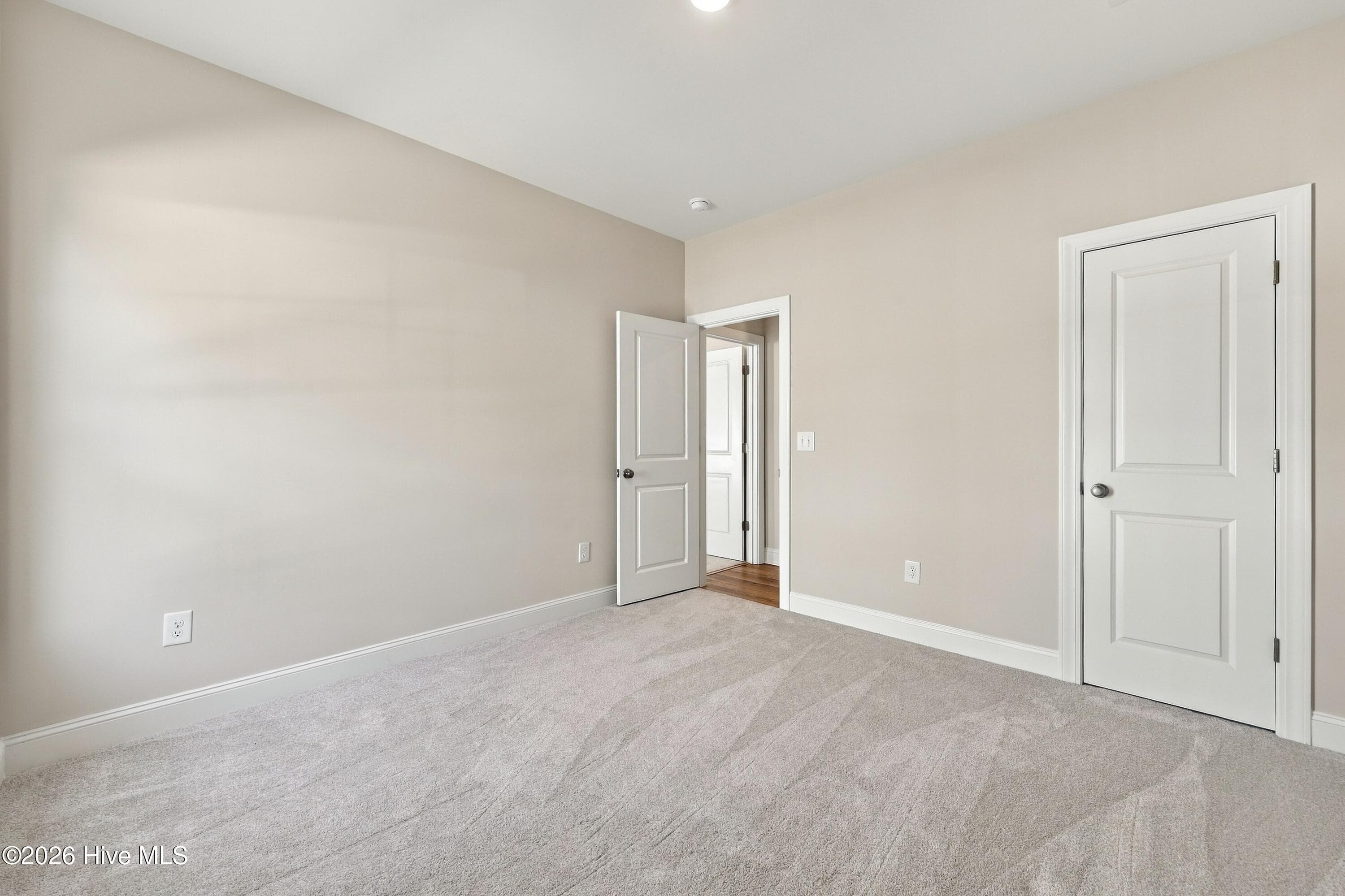 this 3rd bedroom is down the hall with the owner suite next to it - 3229 Meadow Drive, Farmville, NC 27828