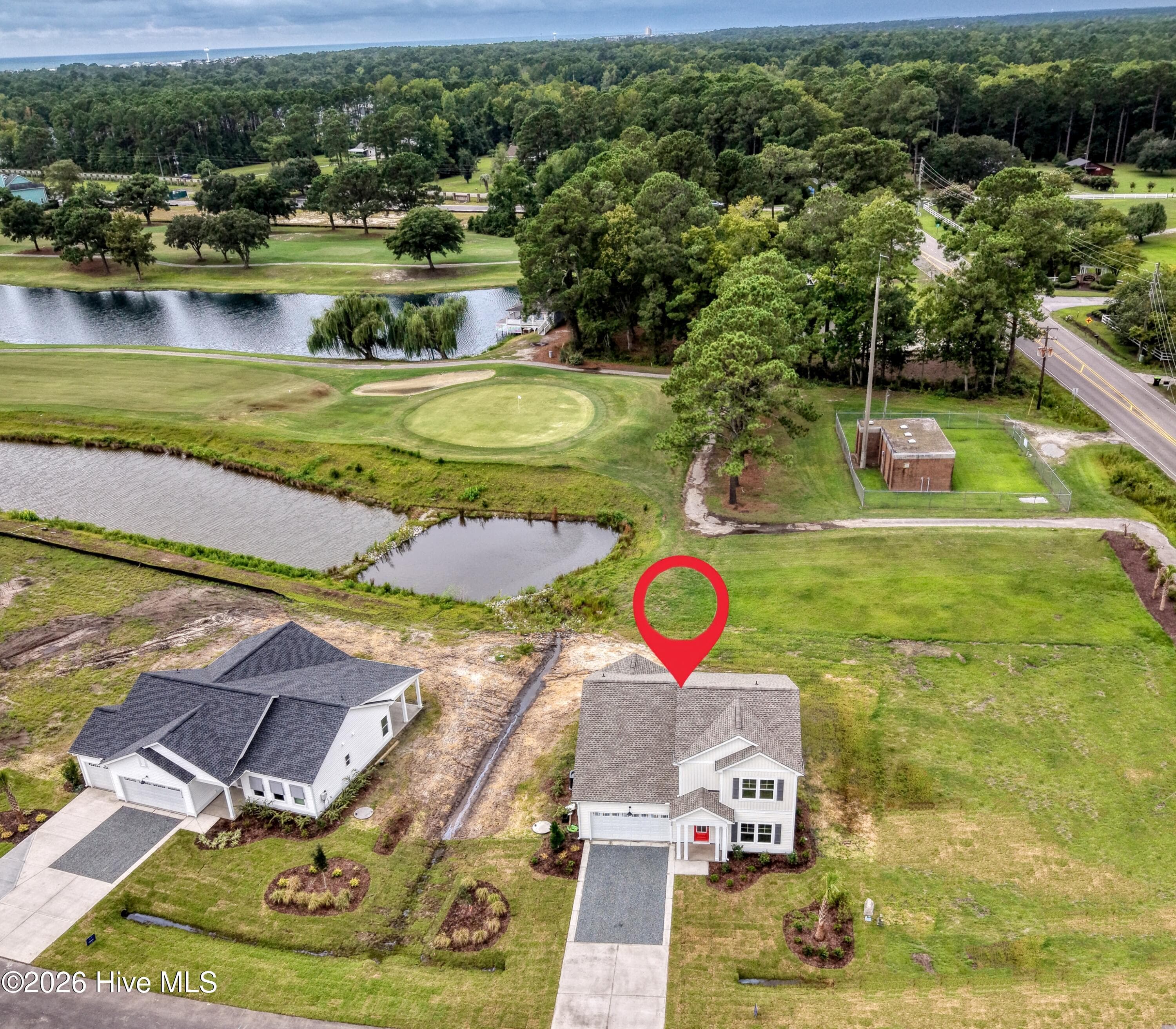Rear of home has views of the 10th hole at The Links at Brick Landing Golf Course. - 2108 Cregan Cove SW (Lot 2), Ocean Isle Beach, NC 28469