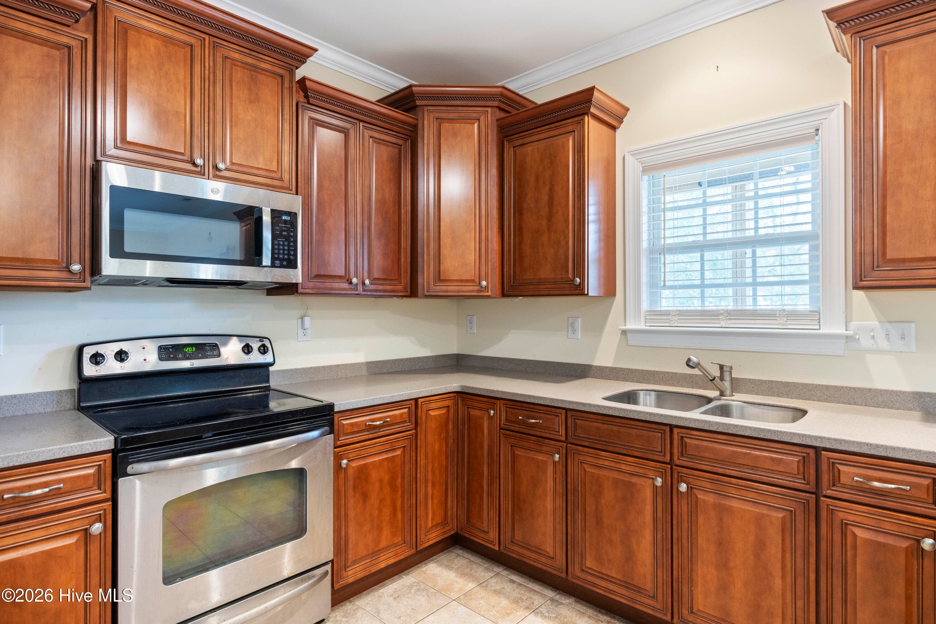 KITCHEN featuring wraparound counters and cabinets - 225 NE 39th Street, Oak Island, NC 28465