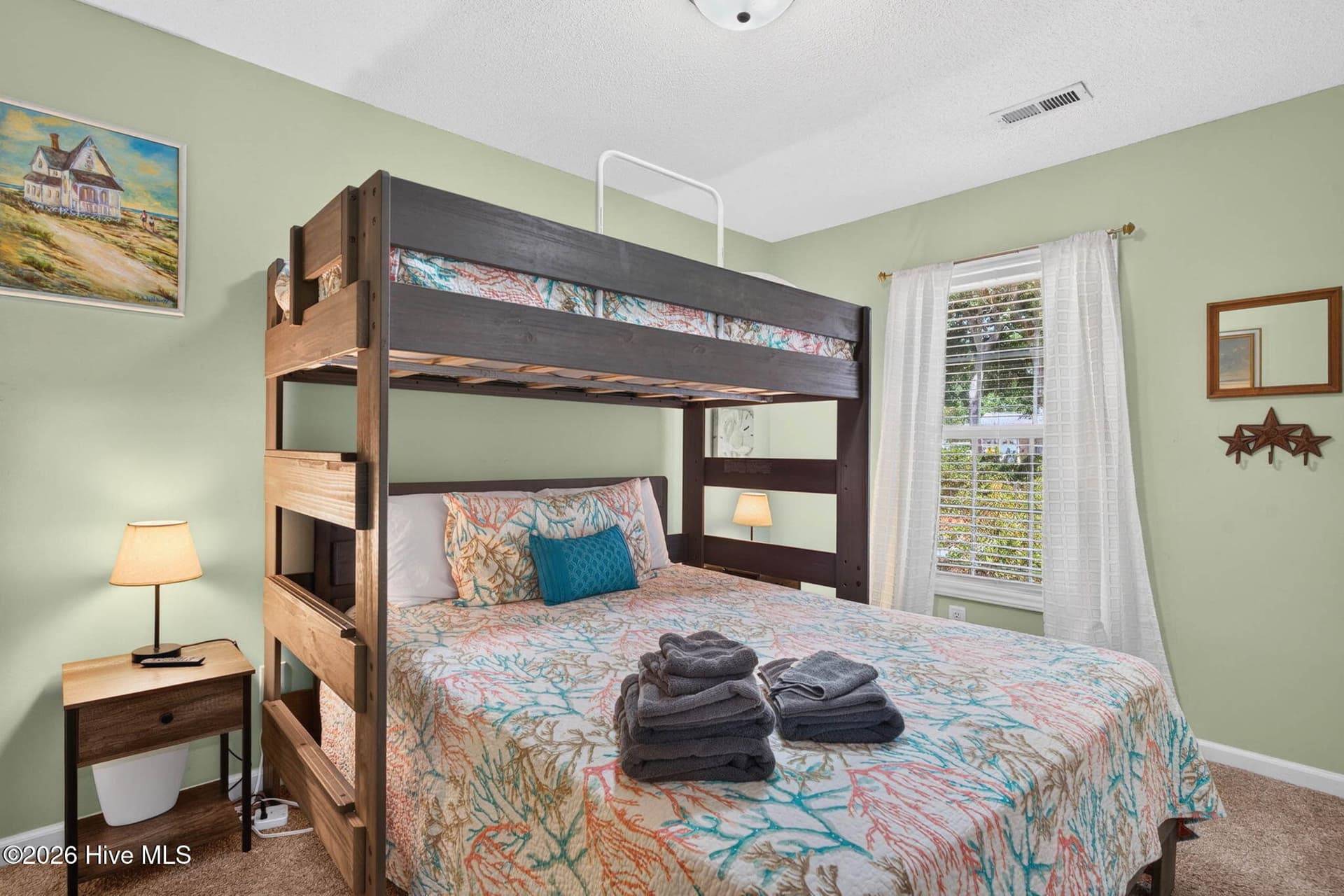 Versatile third bedroom currently arranged with bunk beds, ideal for maximizing sleeping accommodations. - 1650 Frink Street SW, Ocean Isle Beach, NC 28469
