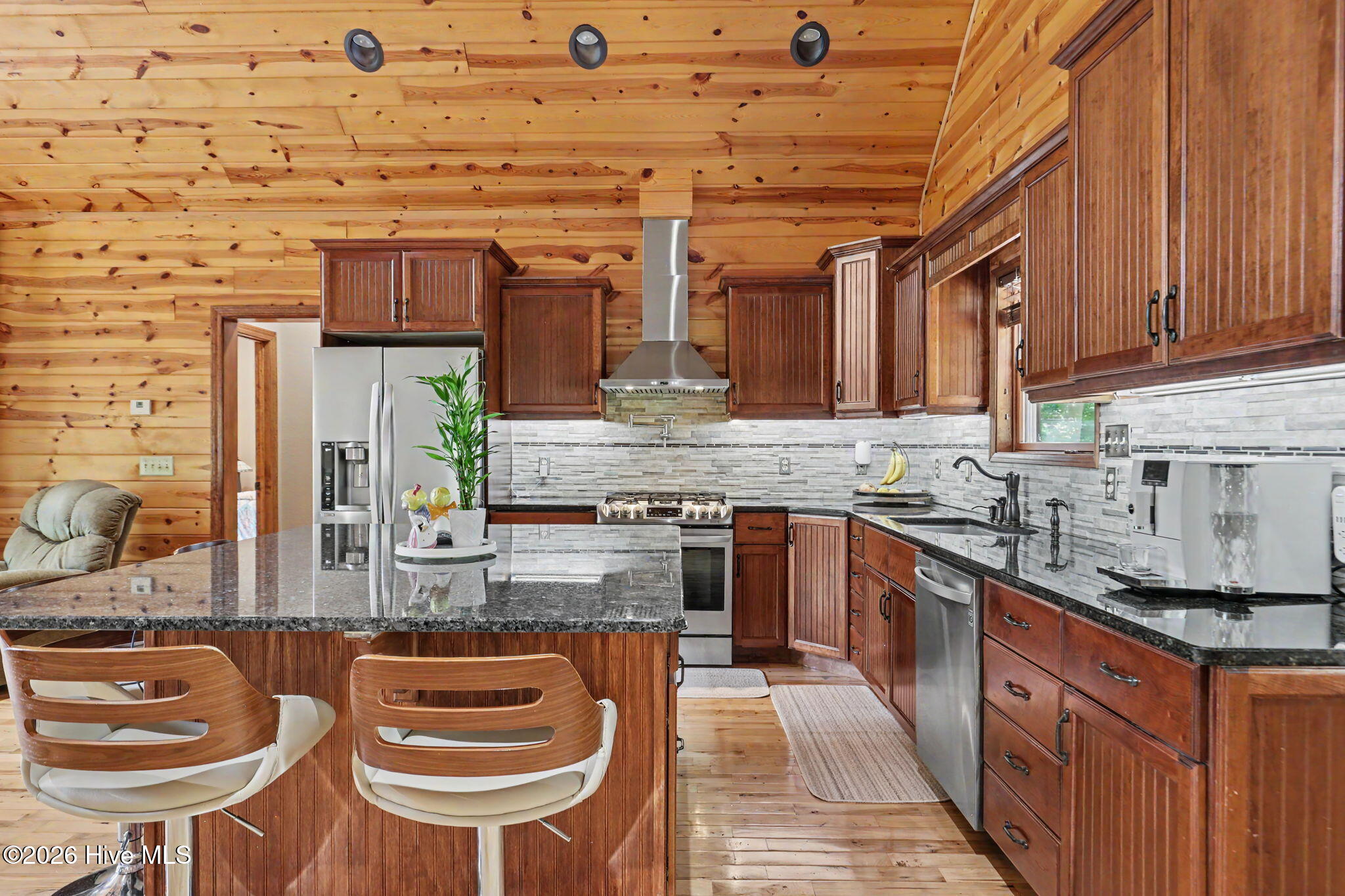 Custom cabinetry, granite countertops and stainless steel appliances, including gas range with pot filler. - 210 Majestic Drive, Hayesville, NC 28904, Hayesville