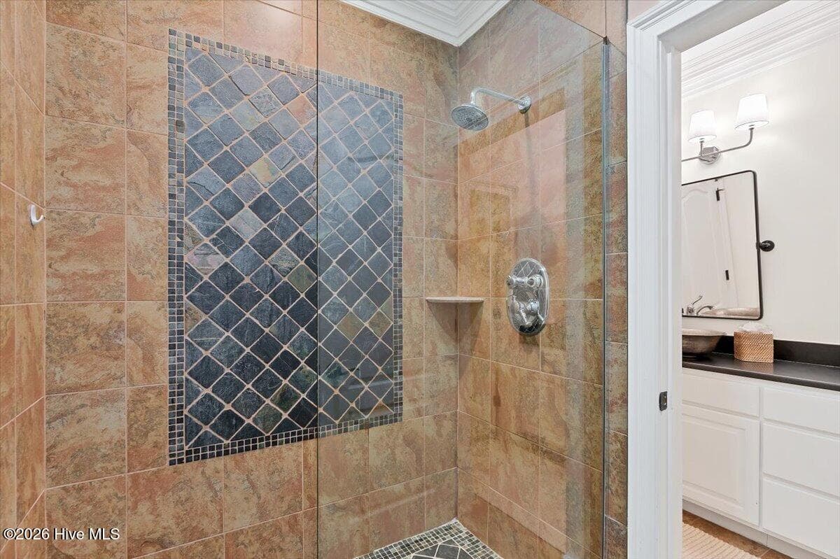 The stunning walk-in shower boasts floor-to-ceiling tile. - 150 Cochrane Castle Circle, Pinehurst, NC 28374