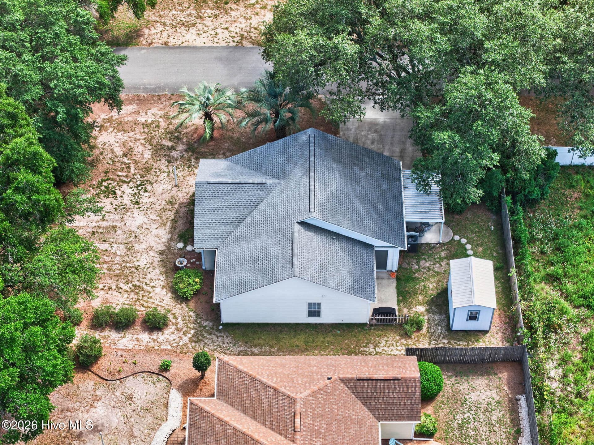 Another aerial perspective highlighting the property's layout and convenient single-level design. - 1650 Frink Street SW, Ocean Isle Beach, NC 28469