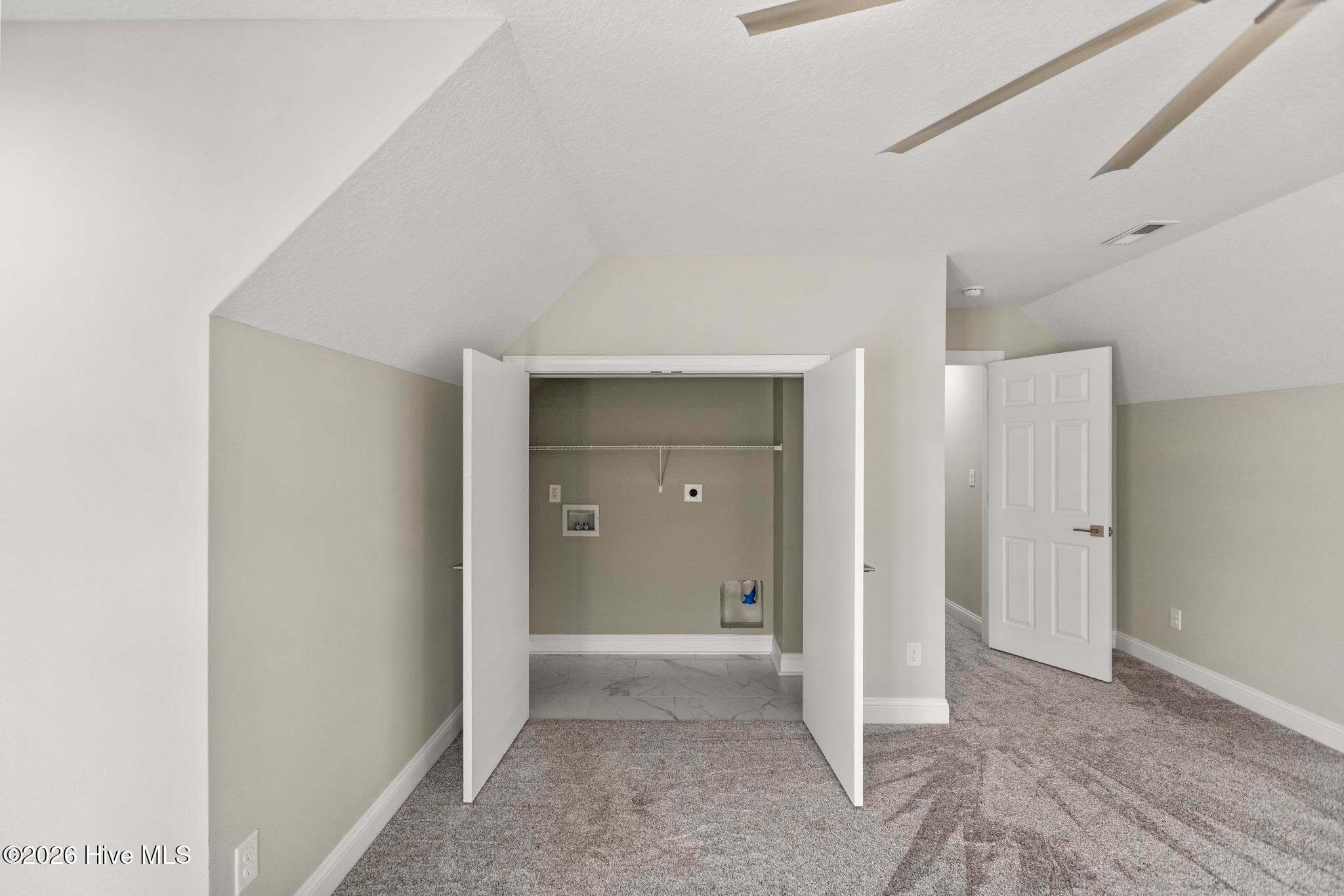 Laundry closet in upstairs bonus room - 401 King Richard Court, Jacksonville, NC 28546