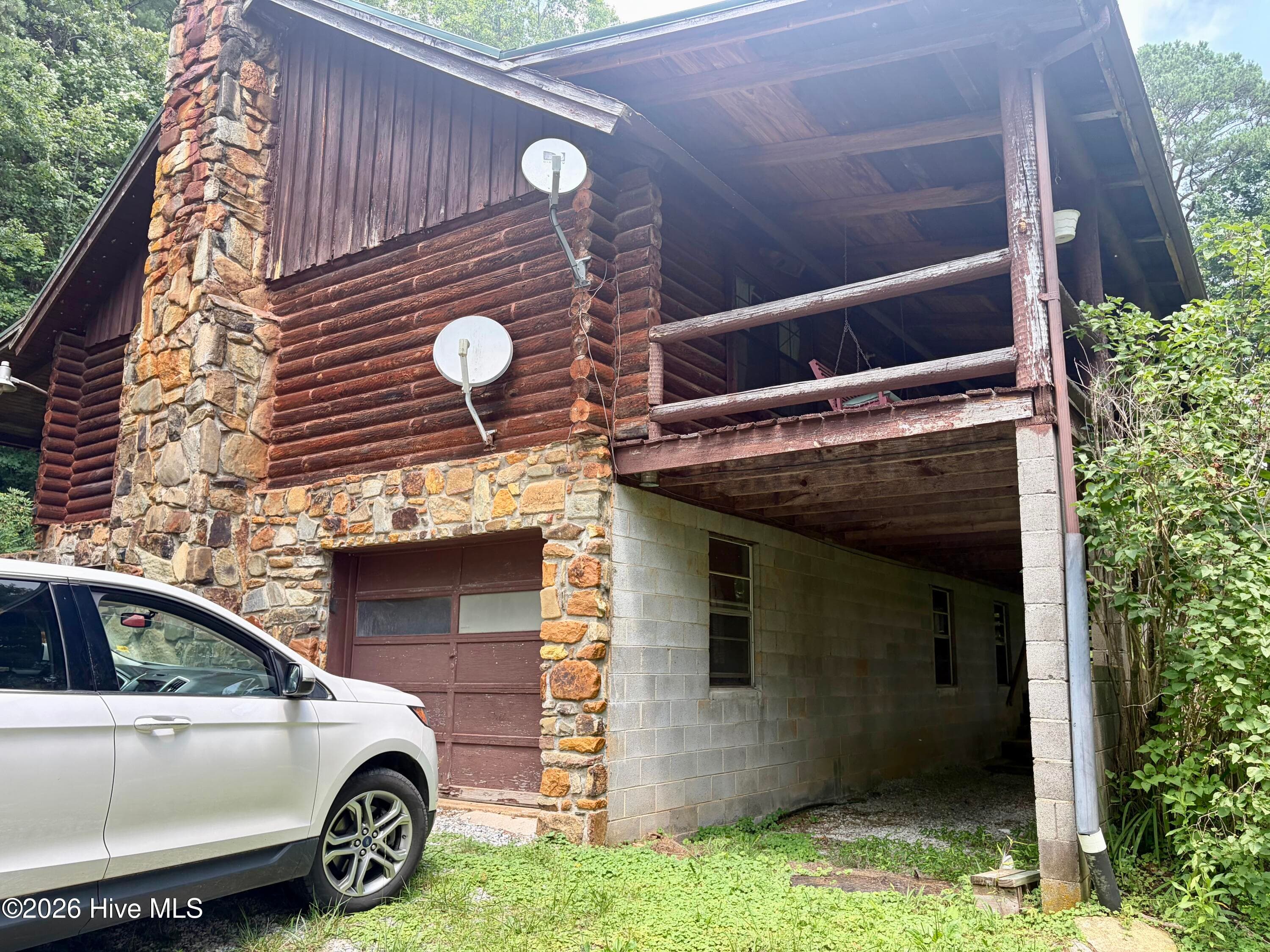 Side view, garage door open to basement - 913 Franks Creek Road, Robbinsville, NC 28771