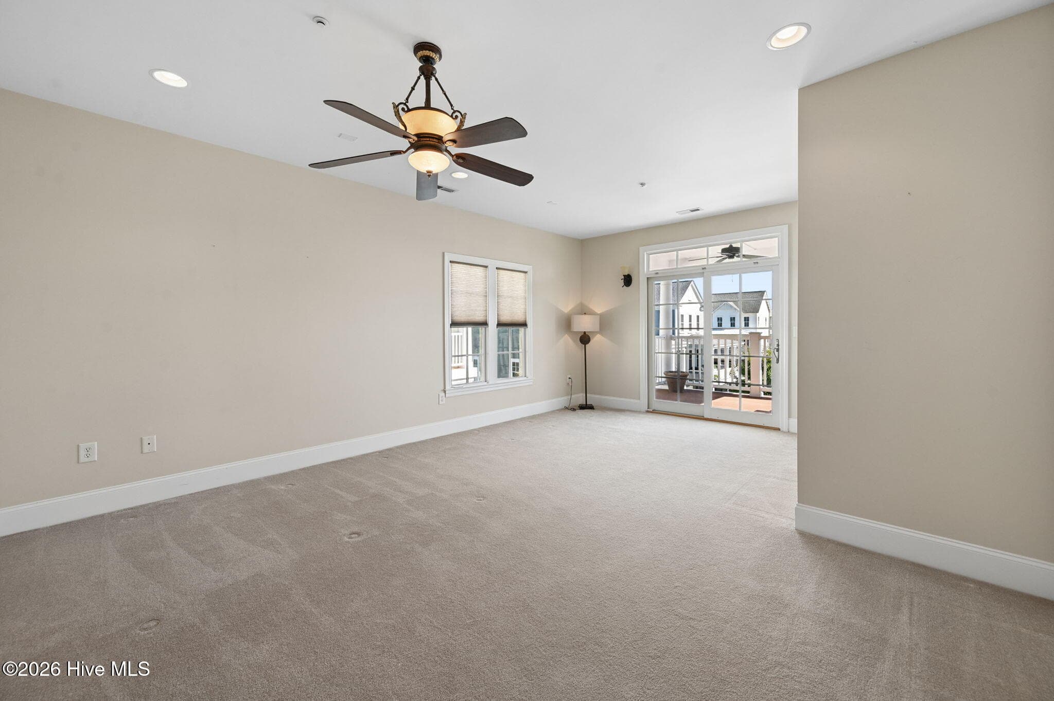 Large Primary Bedroom with addition sitting area and private covered balcony with a view of the Pamlico. - 207 S Academy Street, Washington, NC 27889