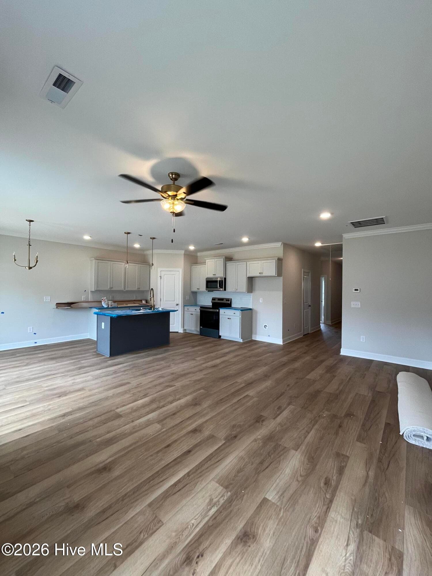 this floor plan invites everyone to gather and converse - 3229 Meadow Drive, Farmville, NC 27828