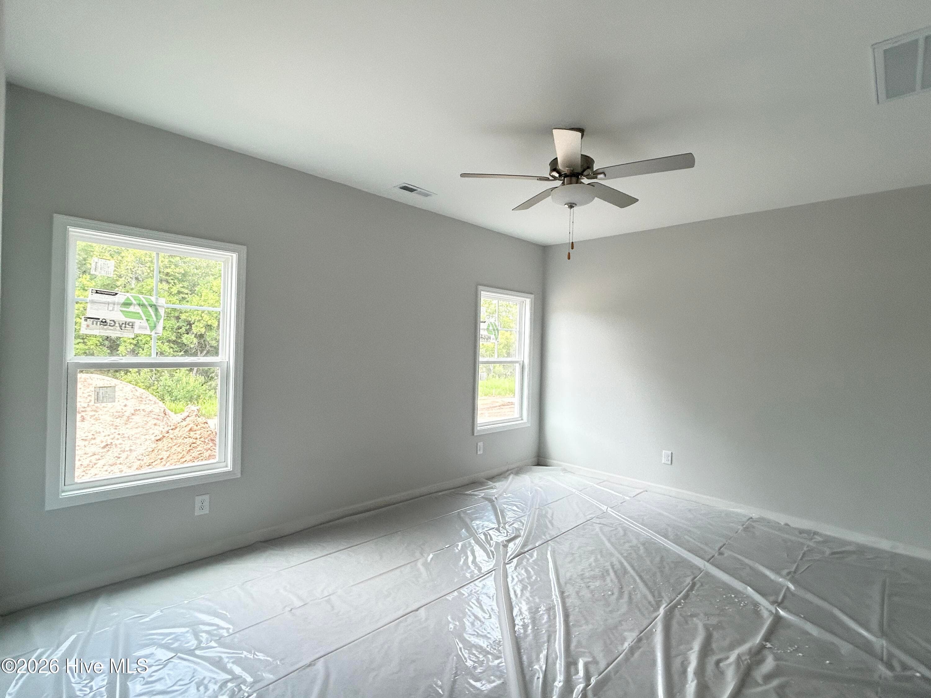 Primary suite features a Private Bathroom with Tile Shower and Large Walk-in Closet - 4149 Workman Loop 67, Leland, NC 28451