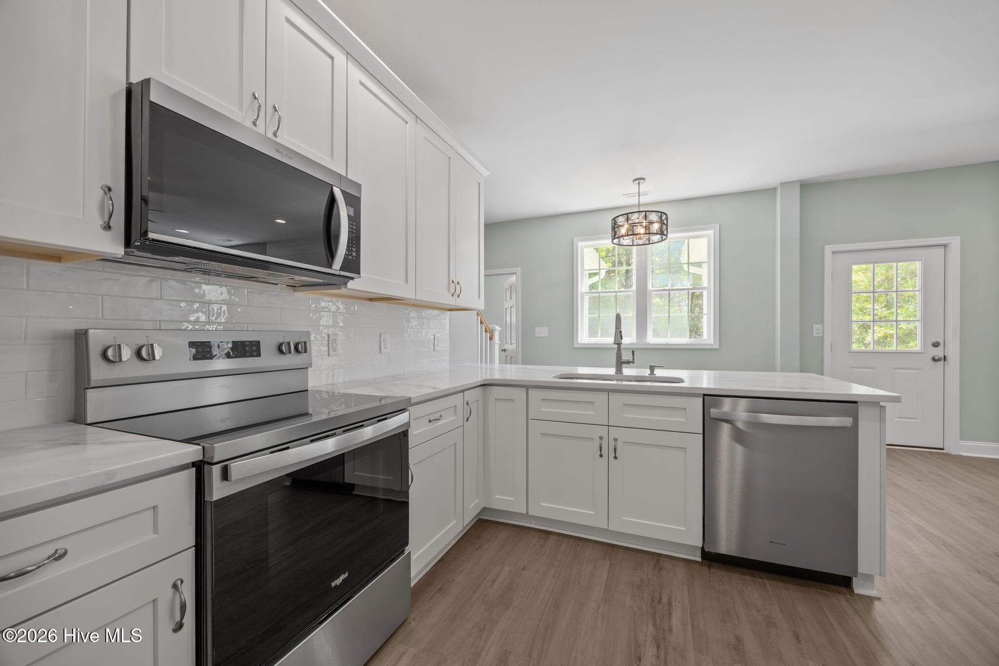 Kitchen with breakfast area overlooking back yard - 7407 Archers Creek Court, Emerald Isle, NC 28594, Emerald Isle