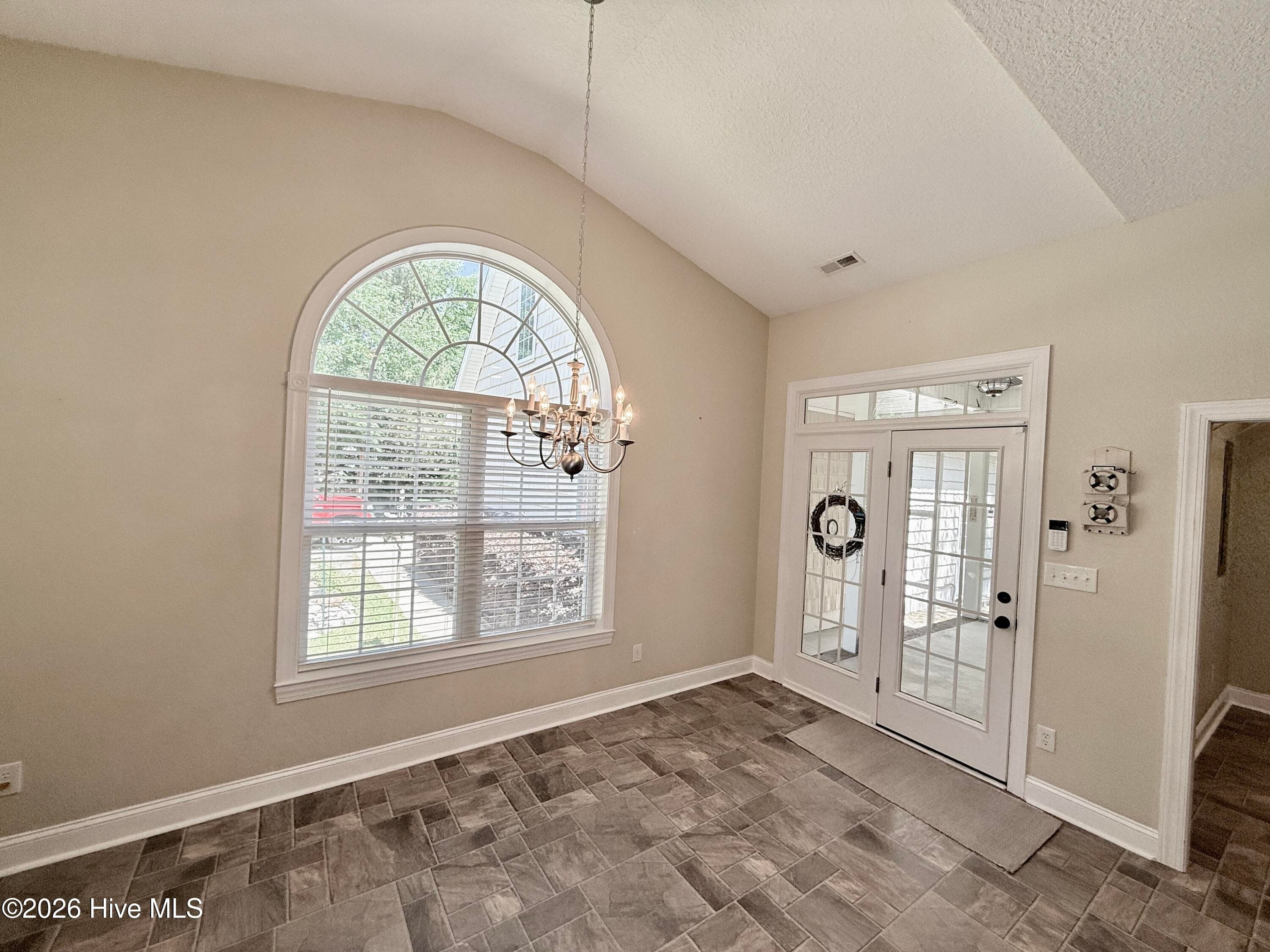 Kitchen dining area and back entrance - 109 Sun Burst Circle, Cedar Point, NC 28584