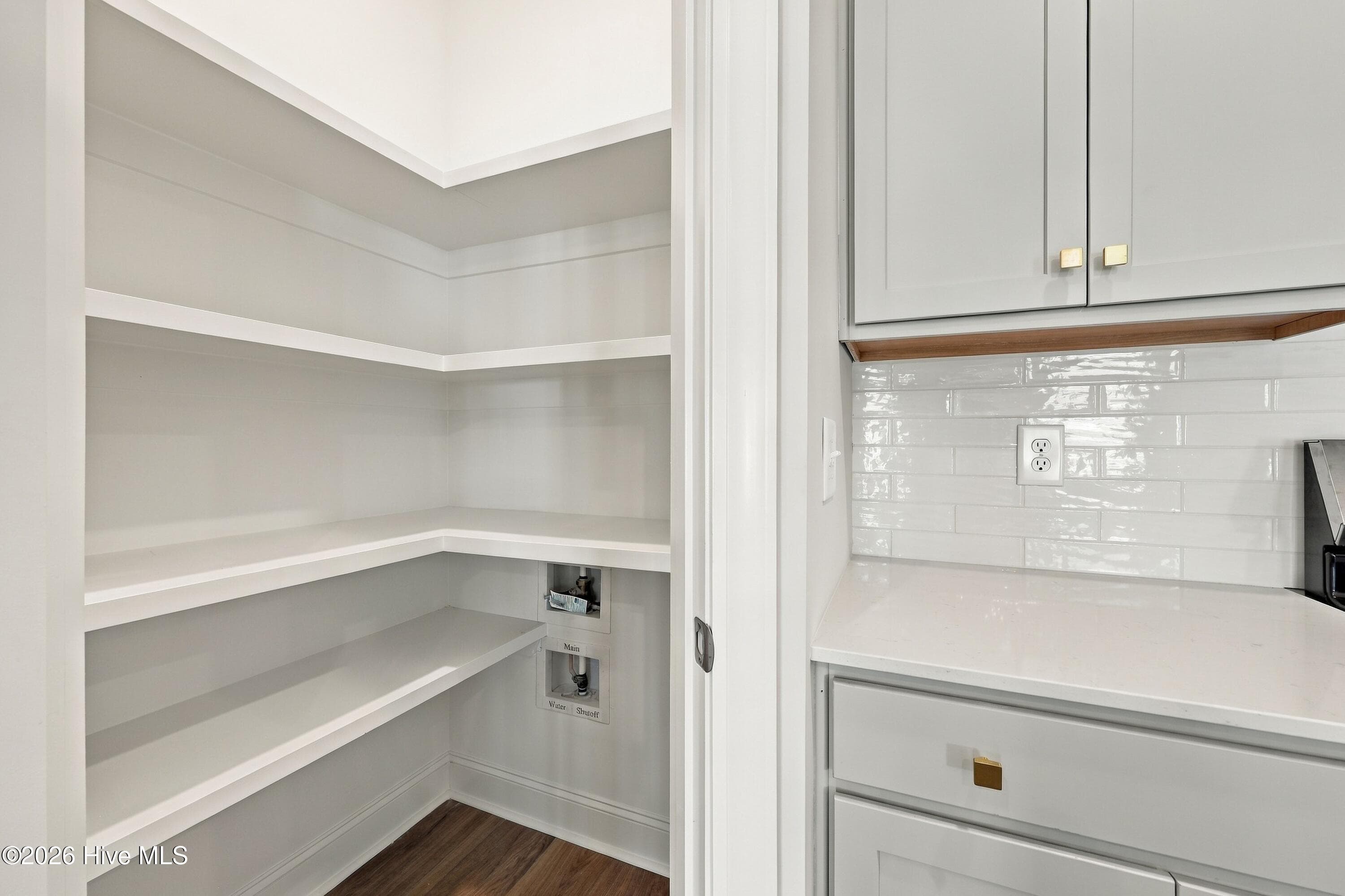walk in pantry with wood custom shelving - 3229 Meadow Drive, Farmville, NC 27828