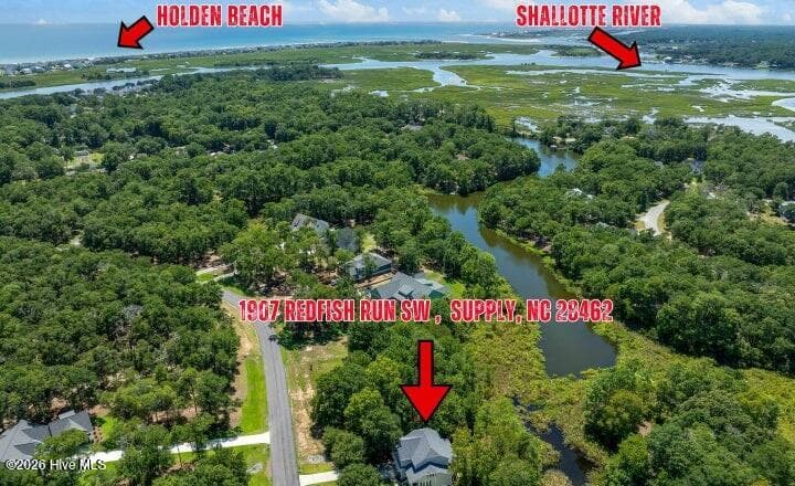 Located directly on a freshwater pond and surrounded by ICW and Shallotte River - 1907 Redfish Run SW, Supply, NC 28462