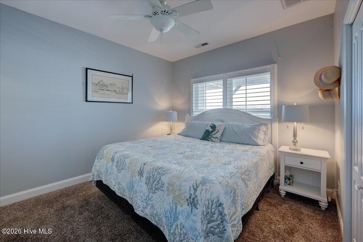 Primary bedroom on the right - 104 Pelican Drive H, Atlantic Beach, NC 28512
