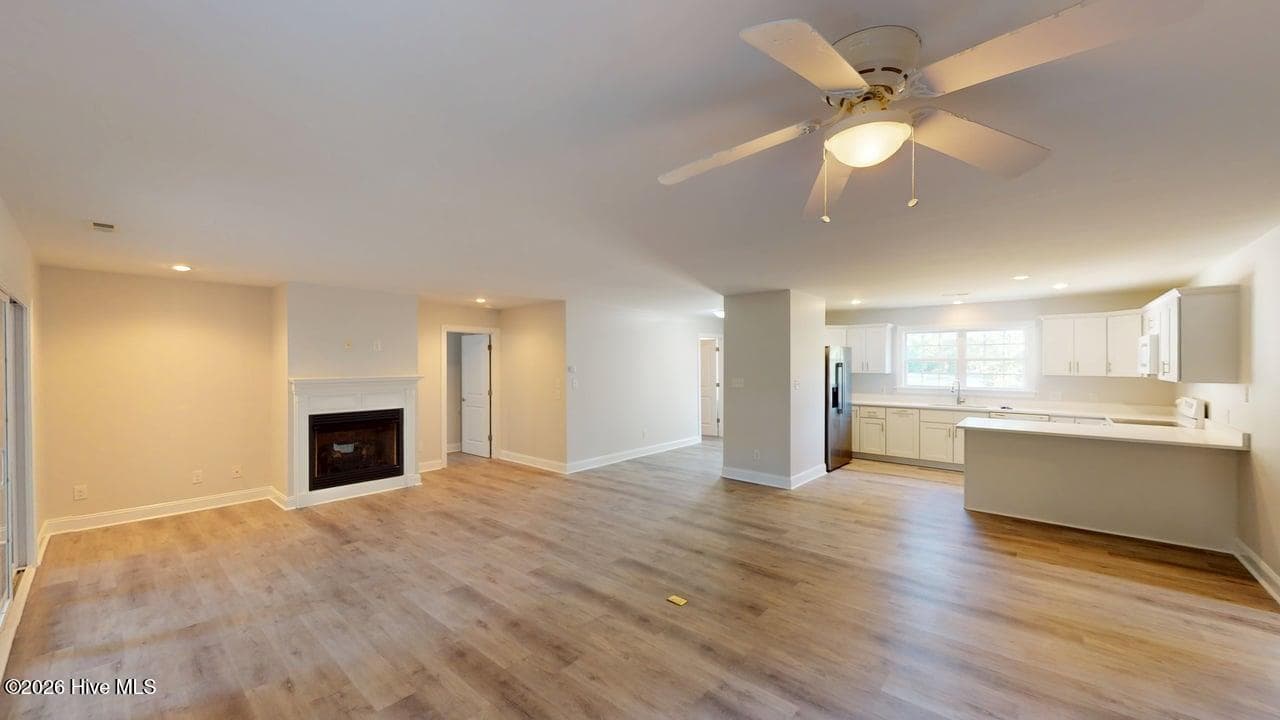 Looking over the ding area, living room, and kitchen. Plenty of space and a great layout for you to place your furniture! - 1114 Barkentine Drive, New Bern, NC 28560
