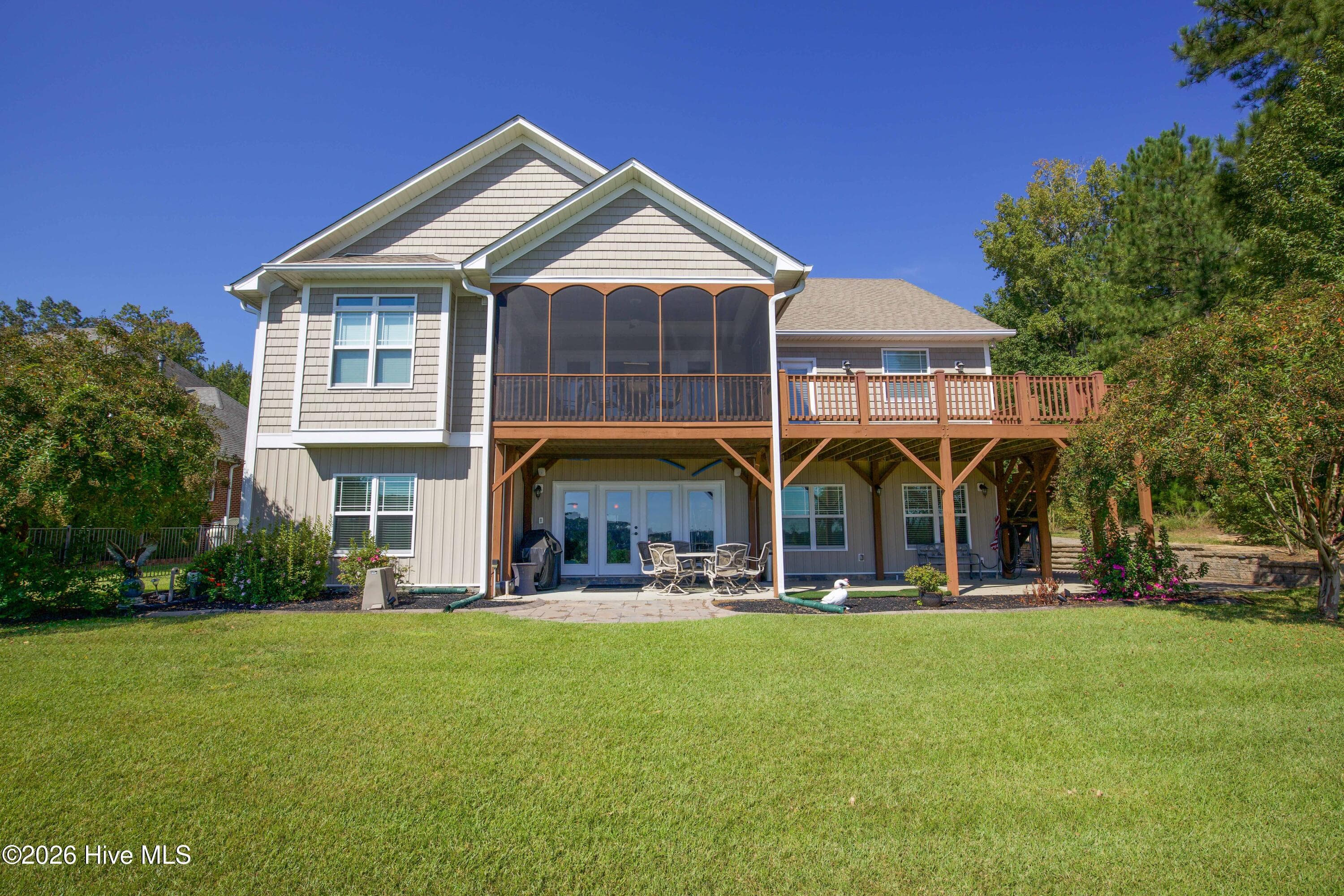 Arched screened porch, deck, and patio at the rear of 899 Seagull Drive in Woodlake, Vass NC. - 899 Seagull Drive, Vass, NC 28394, Vass