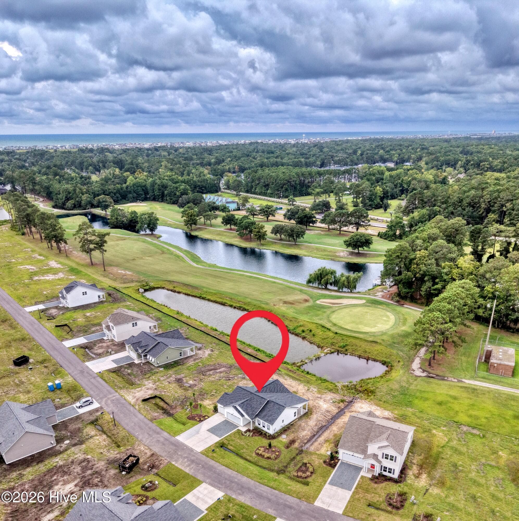Move-in ready home backs up to pond and has views of the golf course. - 2114 Cregan Cove SW (Lot 3), Ocean Isle Beach, NC 28469