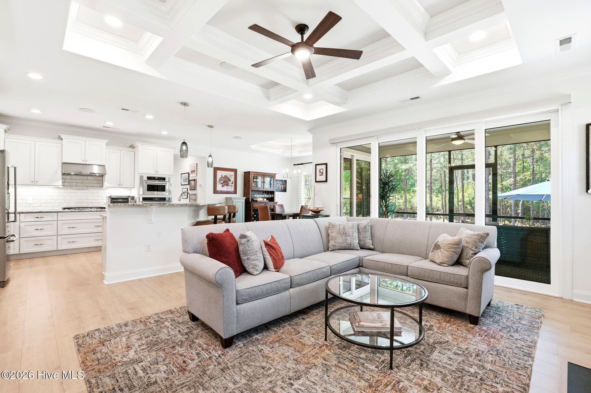 Open-concept living, kitchen, and dining room. - 3710 Friendly Orange Court NE, Leland, NC 28451