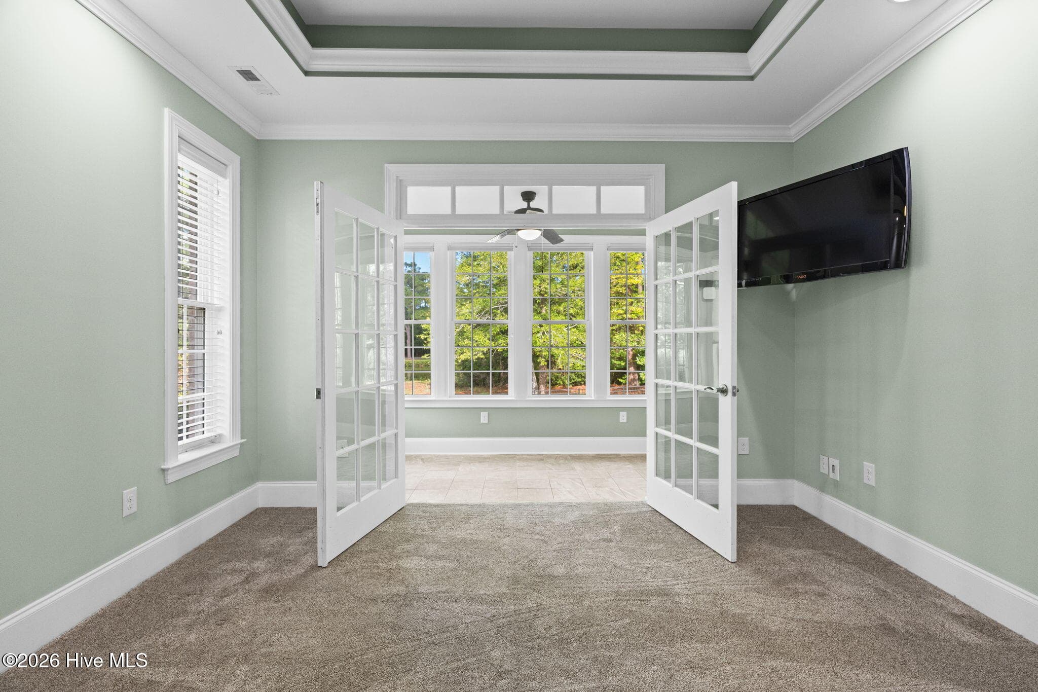 Primary Suite with French Doors to Sunroom - 461 Springwood Drive SE, Bolivia, NC 28422
