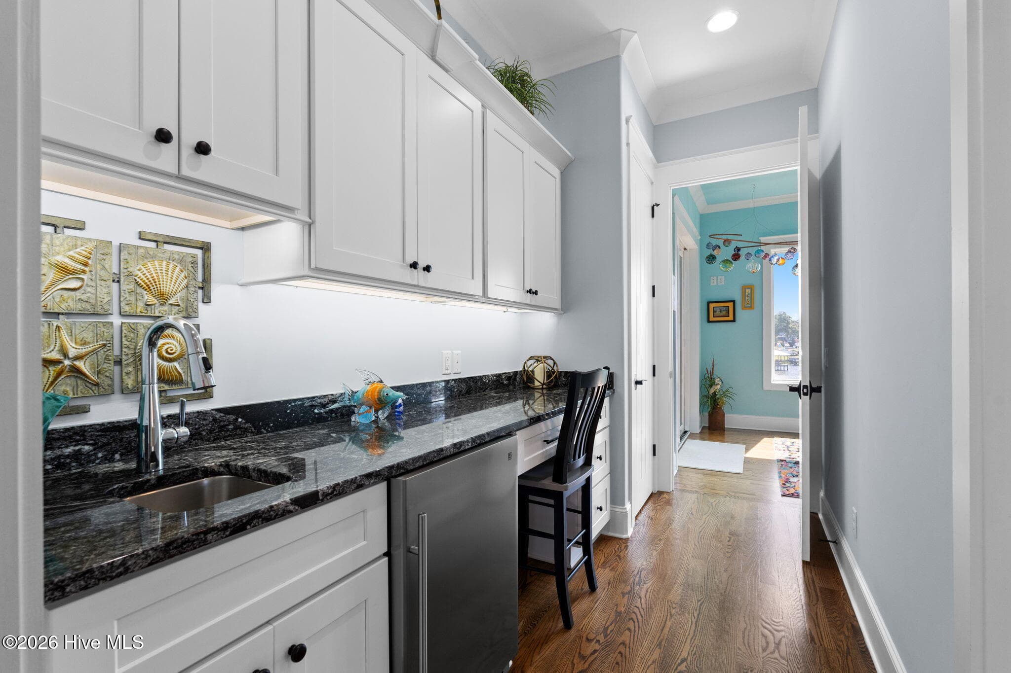 Lots of storage and above and below cabinet lighting provides ambiance for this space - 2775 Long Bay Drive SE, Southport, NC 28461