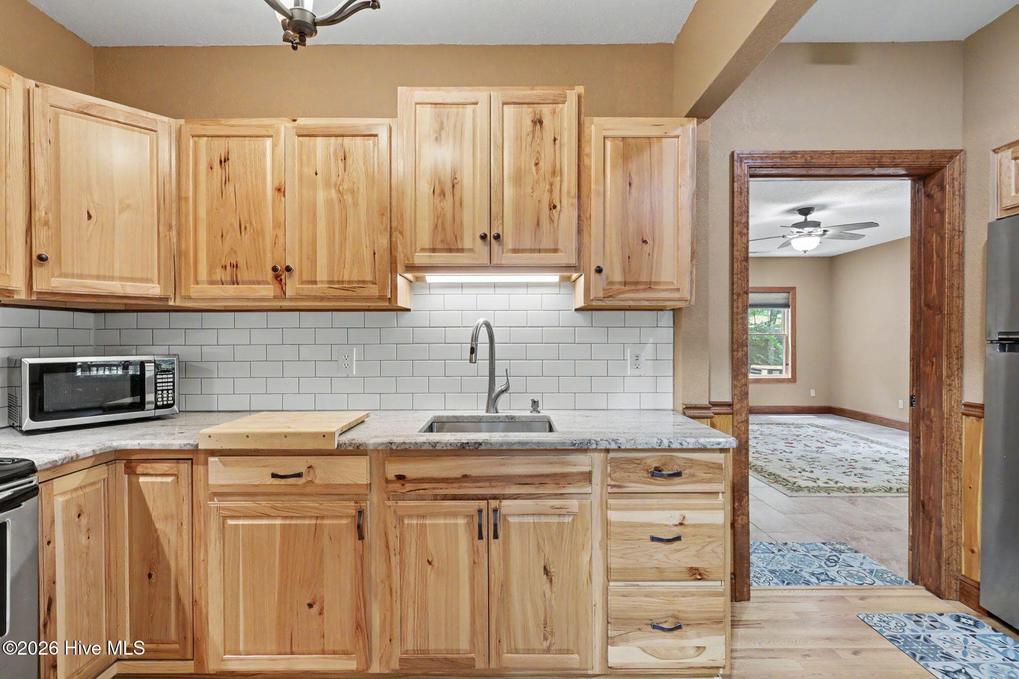 Granite counters and abundant storage add functionality to the second kitchen. - 210 Majestic Drive, Hayesville, NC 28904, Hayesville