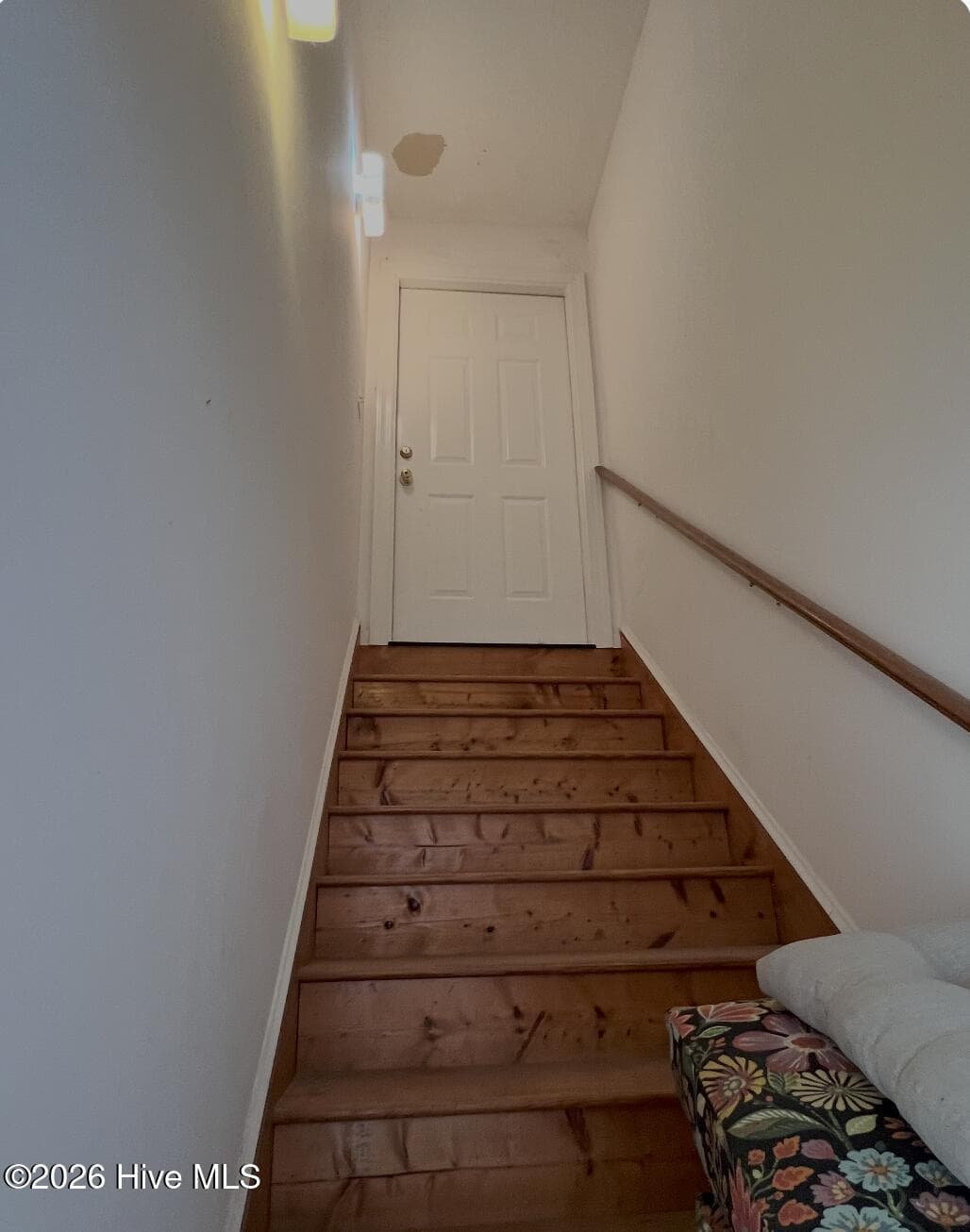 Staircase from Garage leading up to the Bonus Room above garage. - 642 Enoch Road, Clinton, NC 28328