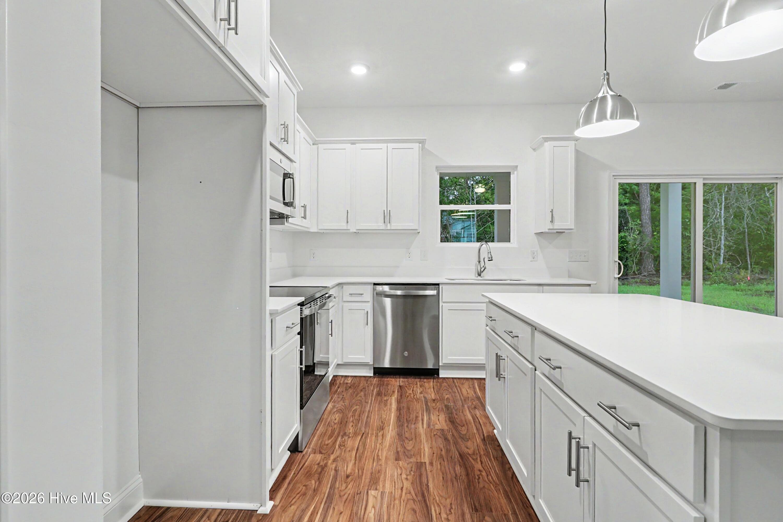Nice views of the rear patio from Kitchen. - 2111 Cregan Cove SW (Lot 19), Ocean Isle Beach, NC 28469