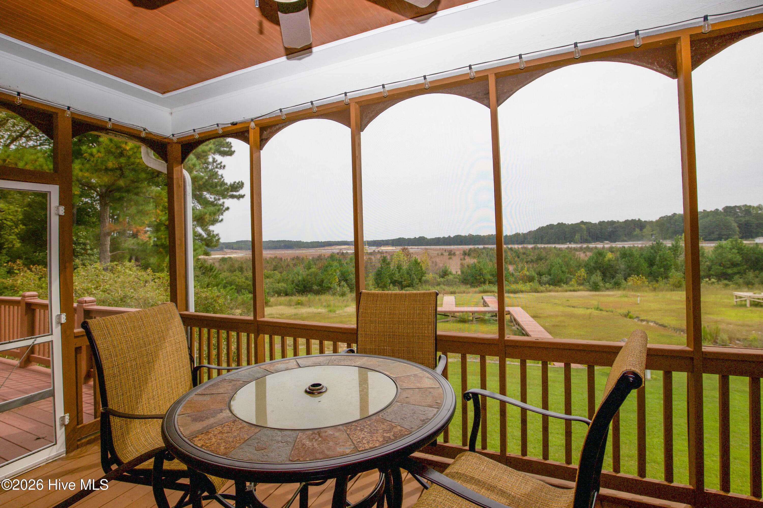 Screened porch overlooking the backyard and Woodlake's currently lakebed. - 899 Seagull Drive, Vass, NC 28394, Vass