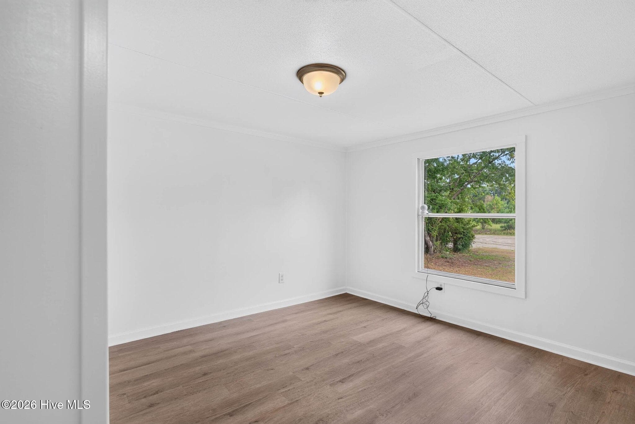 Filled with natural light, this versatile bedroom offers comfort, privacy, and plenty of room to personalize. - 1199 Zack Street SE, Bolivia, NC 28422