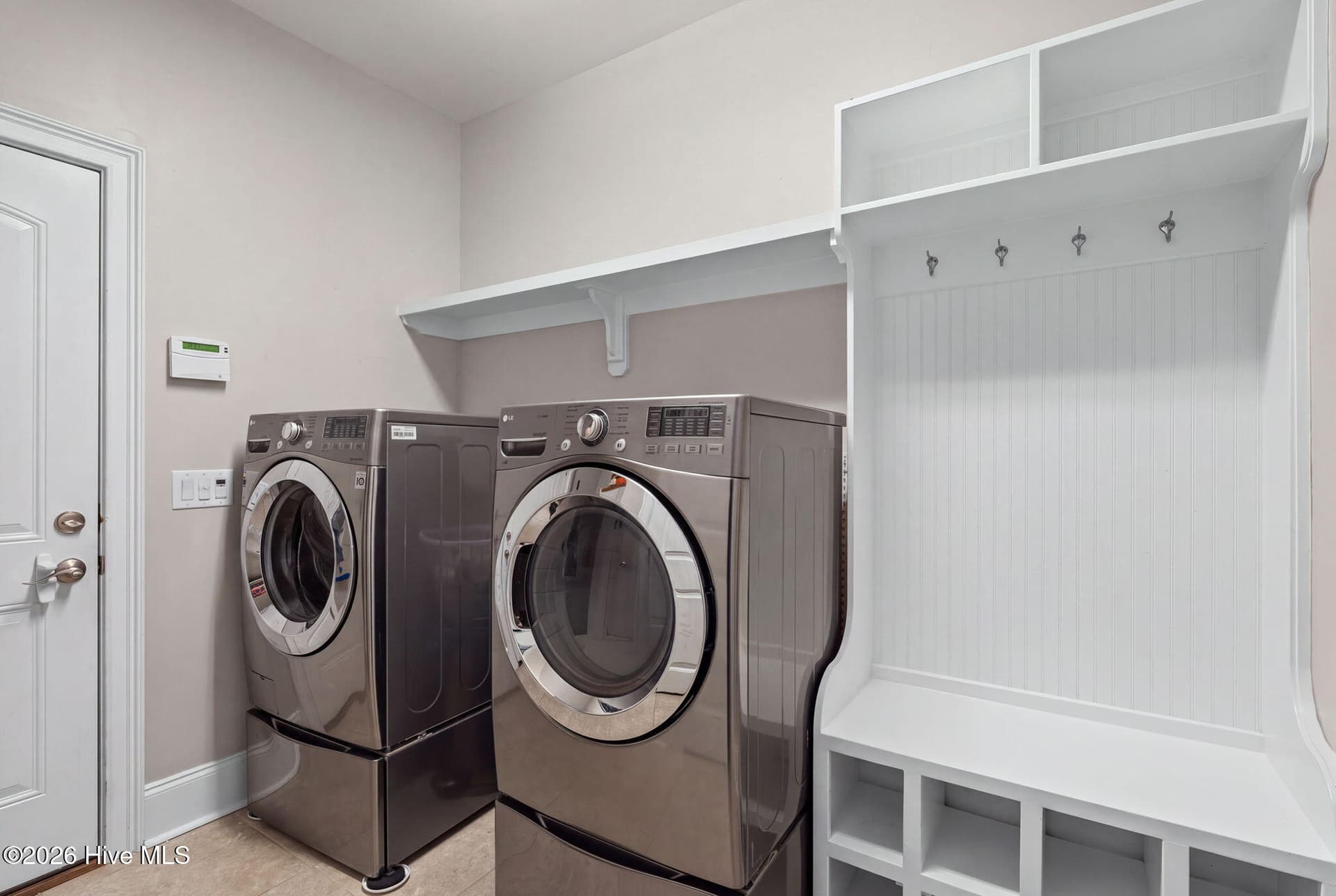 Large laundry area with drop zone from garage entry - 6363 Havencrest Drive SW, Ocean Isle Beach, NC 28469