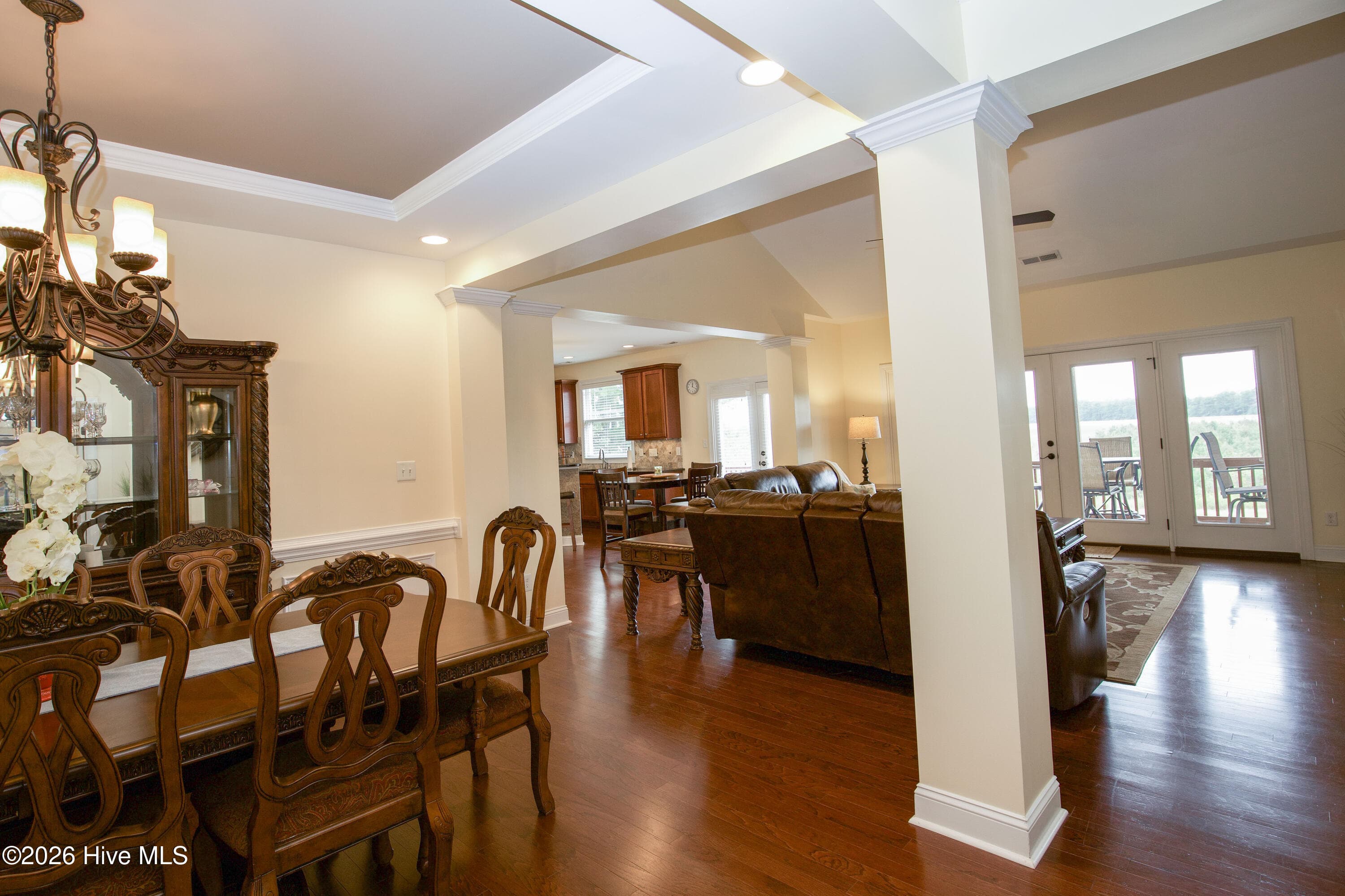 Dining room with columned openings to the living room. - 899 Seagull Drive, Vass, NC 28394, Vass