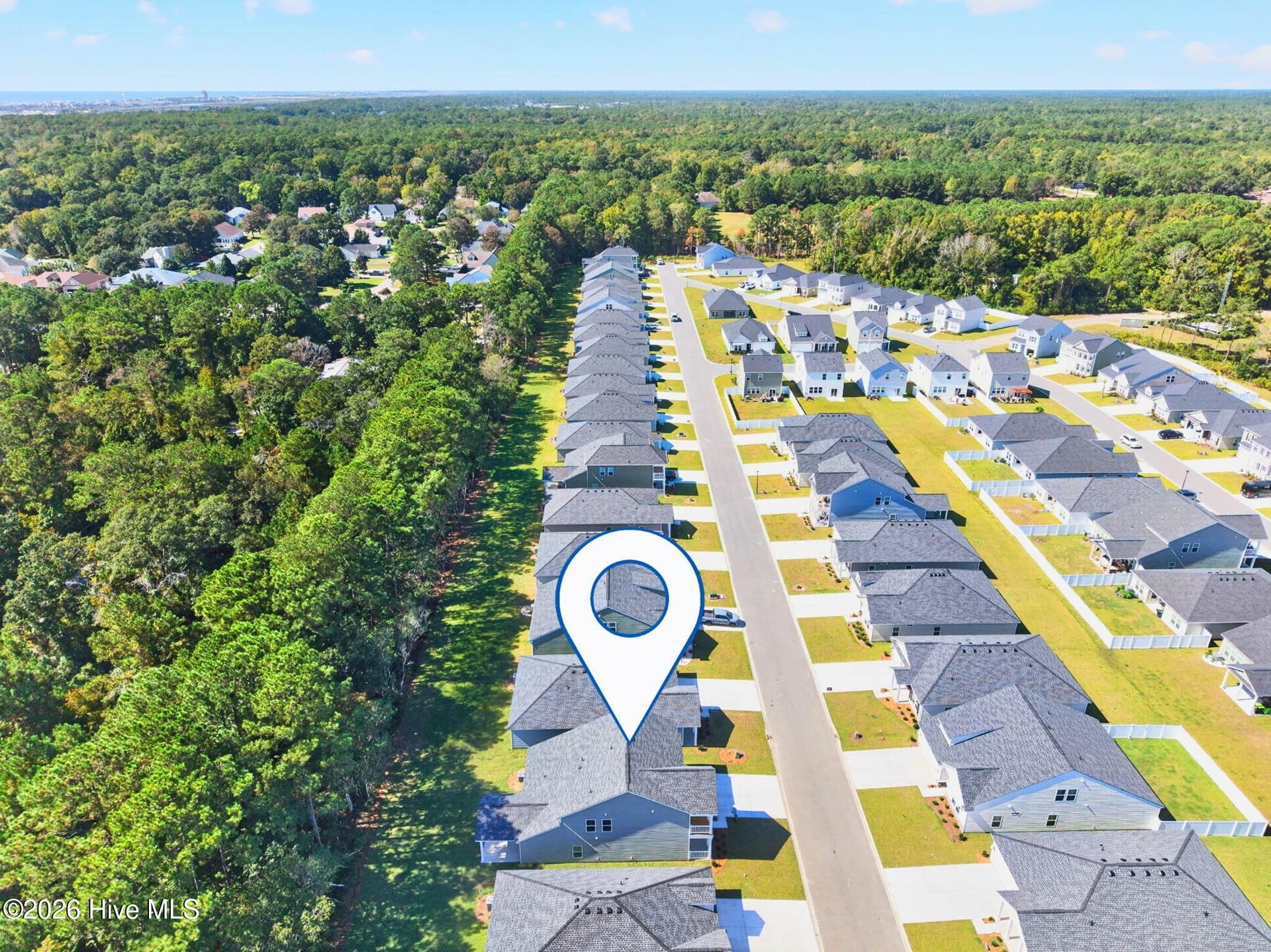 Aerial perspective of Wood Stork Landing showcasing the community's residential streets and surrounding greenery. - 3447 Sandhill Crane Drive SW, Ocean Isle Beach, NC 28469