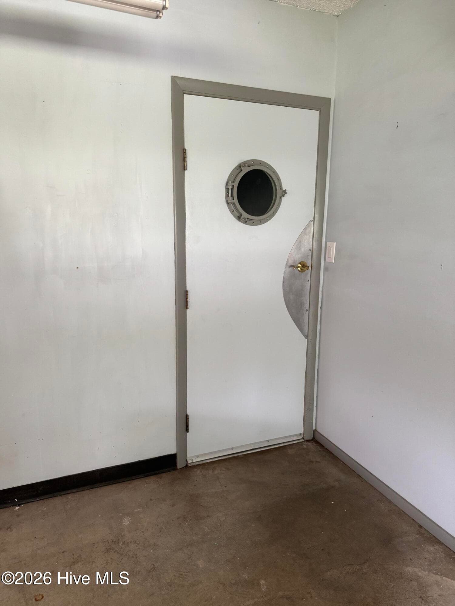 Of coarse you would expect to find a 'Porthole' in the door of a Navy person. - 118 Oakwood Drive, Havelock, NC 28532