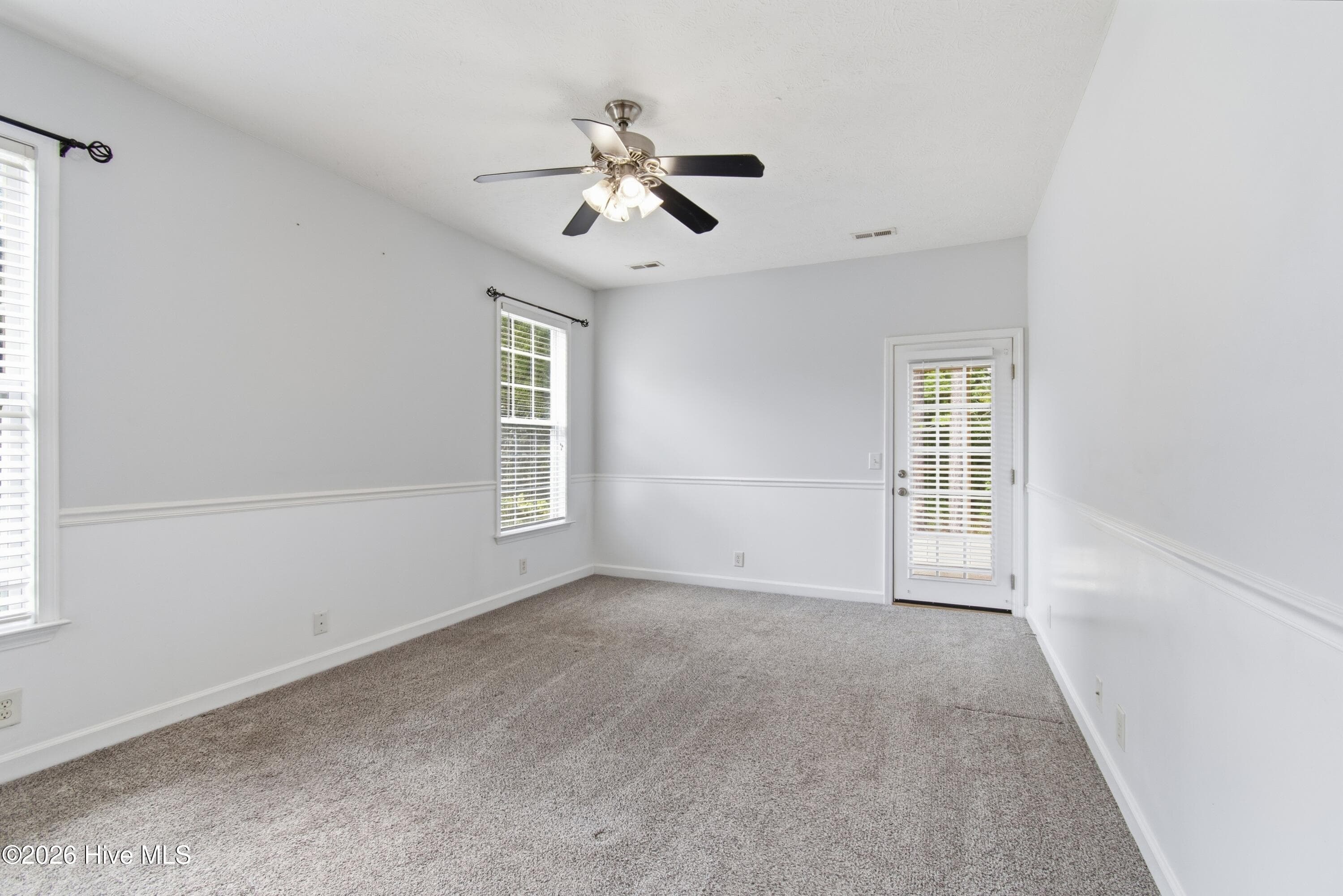 Primary bedroom with wainscoting. - 709 E Pipers Glen, Shallotte, NC 28470