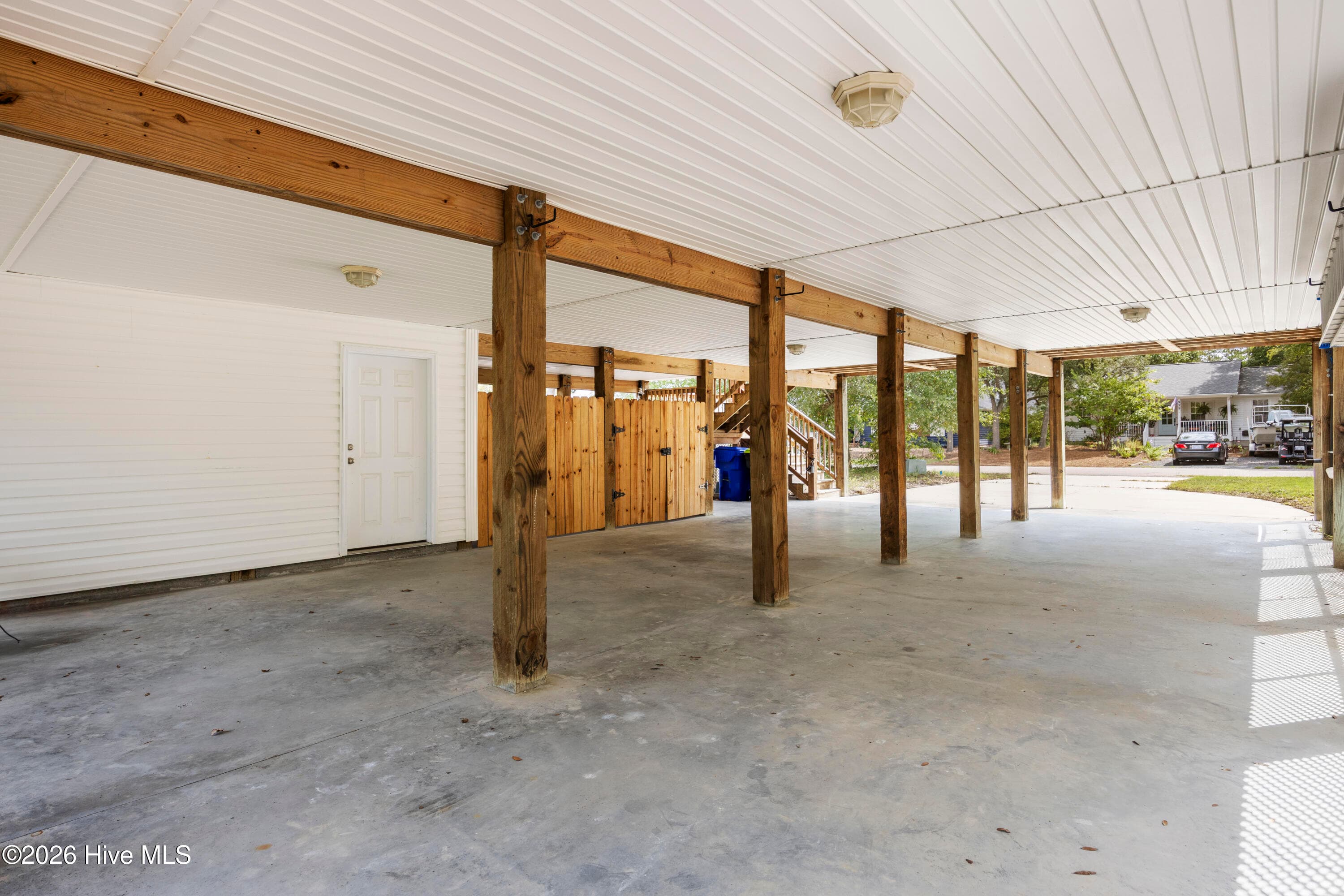COVERED PARKING on ground level, with Storage Room and Lockup Area on the left - 225 NE 39th Street, Oak Island, NC 28465