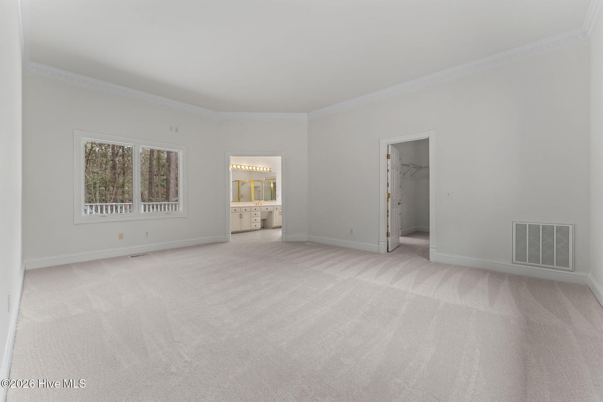 Primary bedroom with separate door to the deck. Large walk in closets. - 22 Lochmere Drive, Pinehurst, NC 28374
