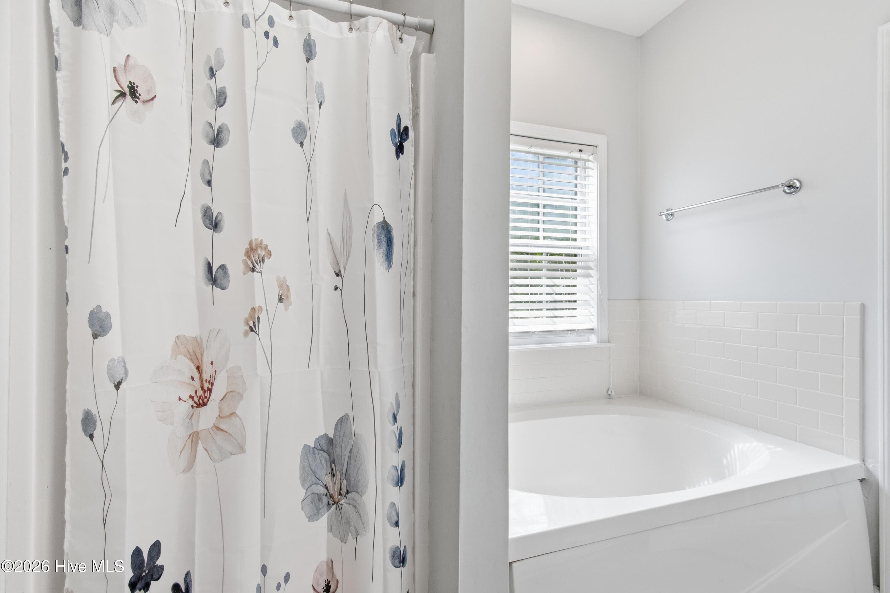 Primary en suite bathroom with tub and shower. - 709 E Pipers Glen, Shallotte, NC 28470