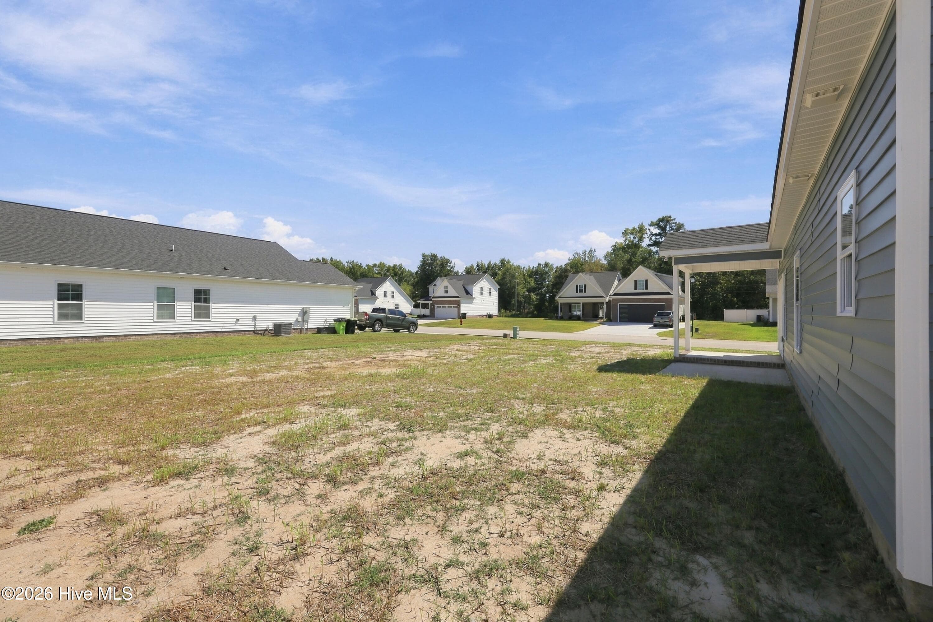 large back yard , with a covered porch for evening cook outs ! - 3229 Meadow Drive, Farmville, NC 27828