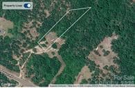 lot is cleared & over 50% wooded in the back. Long private drive, can not see house from the road. - 505 Addor Road, Pinebluff, NC 28373, Pinebluff