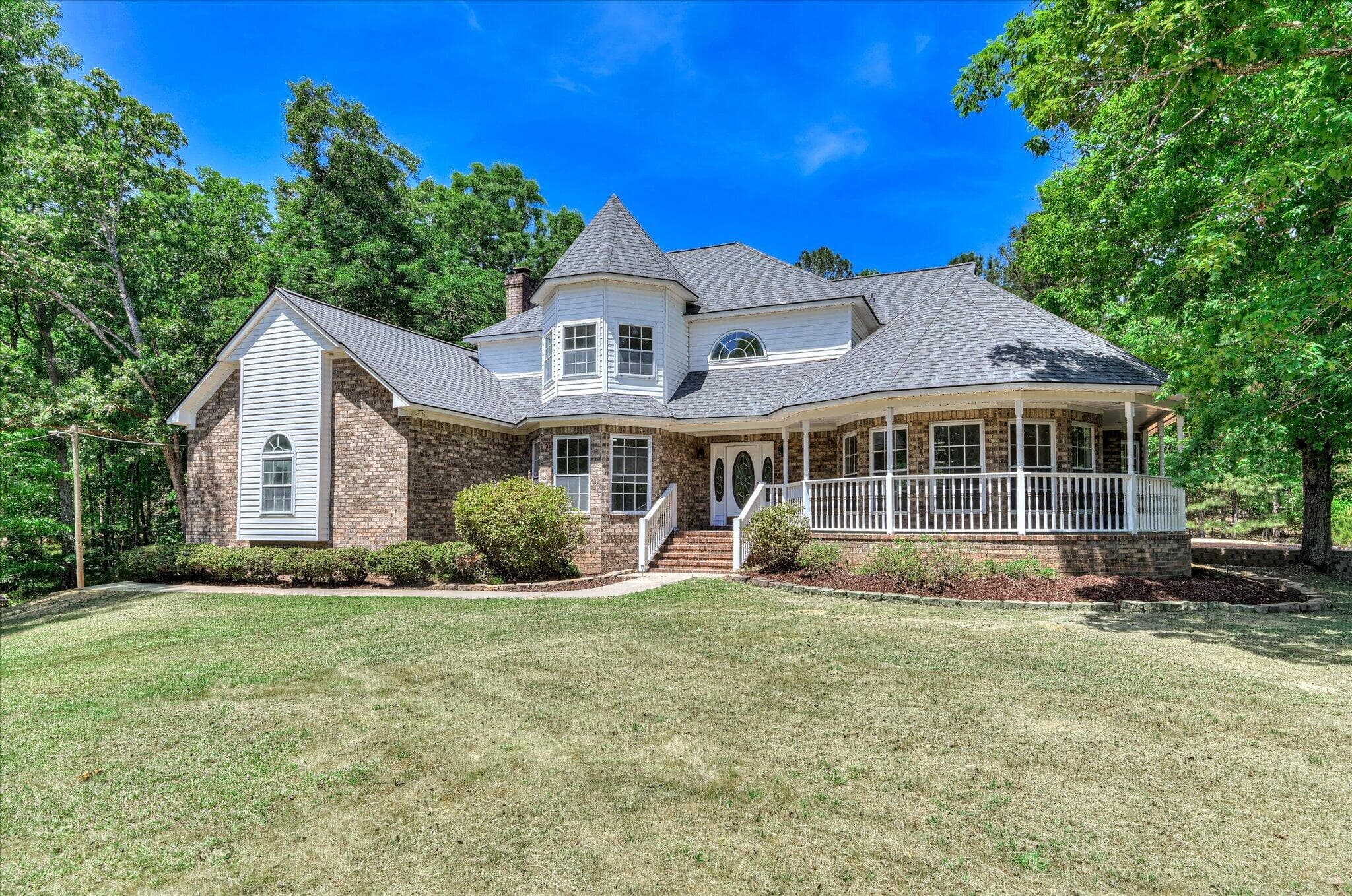 Peaceful living with a wrap around porch. - 1154 Water Oak Drive, Lincolnton, GA 30817