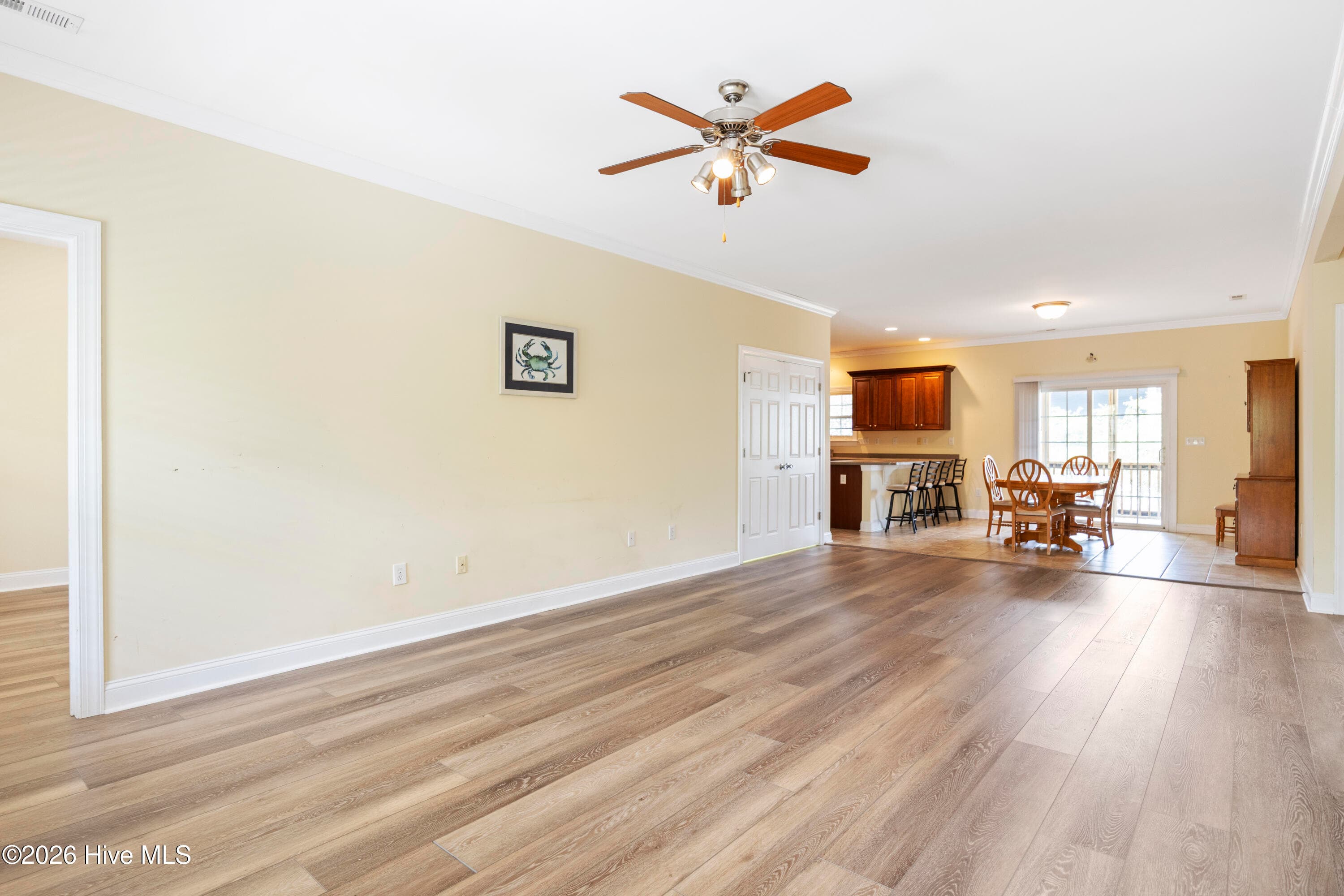 LIVING ROOM, looking toward Dining Room and Kitchen - 225 NE 39th Street, Oak Island, NC 28465