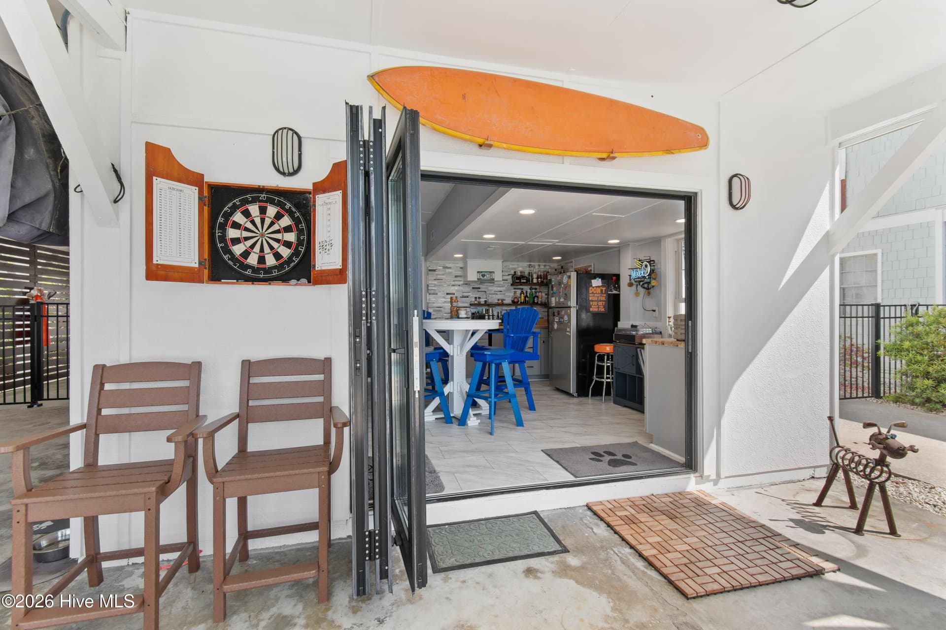 Ground floor bar, kitchenette with folding patio doors. - 2024 Camelot Drive SW, Ocean Isle Beach, NC 28469